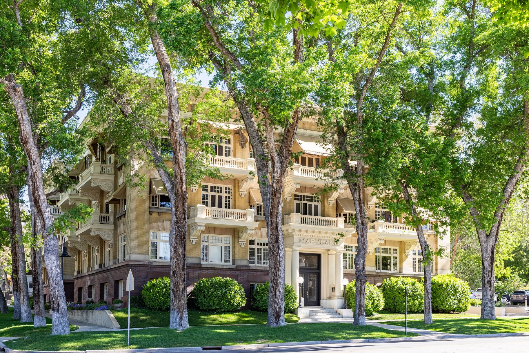 The Maryland is an iconic building on historic South Temple Street - a little slice of New York City in the heart of Salt Lake City. A warm marble staircase welcomes you into hallways lined with exquisitely carved crown molding, and that timeless elegance continues throughout Unit #204. Upon entering, you are greeted by the classic Maryland hallway that opens into a bright, spacious living room filled with natural light. Original folding French doors connect the dining room and living room, creating a seamless flow ideal for entertaining friends and family. The spaces feel both expansive and inviting, perfectly suited for gatherings large or small.  The kitchen features granite countertops, classic white cabinetry, a vintage-style refrigerator, and original tile flooring. An adjoining "New York-style" back porch brings in additional light while offering valuable extra storage space. The bedroom includes two closets and an adjoining nook that is generously sized and ideal for a home office, reading area, or exercise space.  The main floor full bath is easily accessible from the bedroom and living areas.  This classic condo beautifully blends historic character with modern city living.  Extraordinary natural light fills the home throughout the day, highlighting the original architectural details alongside thoughtful updates. The result is a refined yet comfortable atmosphere with a sense of quiet calm that is surprisingly rare in the heart of Salt Lake City.  The building itself is exceptionally peaceful and well preserved, offering both charm and privacy. Every room feels spacious and welcoming, while the balance of historic architecture and modern touches creates a home that feels timeless, sophisticated, and deeply livable.  Located near downtown Salt Lake City at the edge of the Avenues, The Maryland offers the perfect balance of urban convenience and residential tranquility. The historic neighborhood is highly walkable, with local restaurants, coffee shops, and small businesses just minutes away. With its strong sense of character and community, this is an exceptionally enjoyable place to call home.