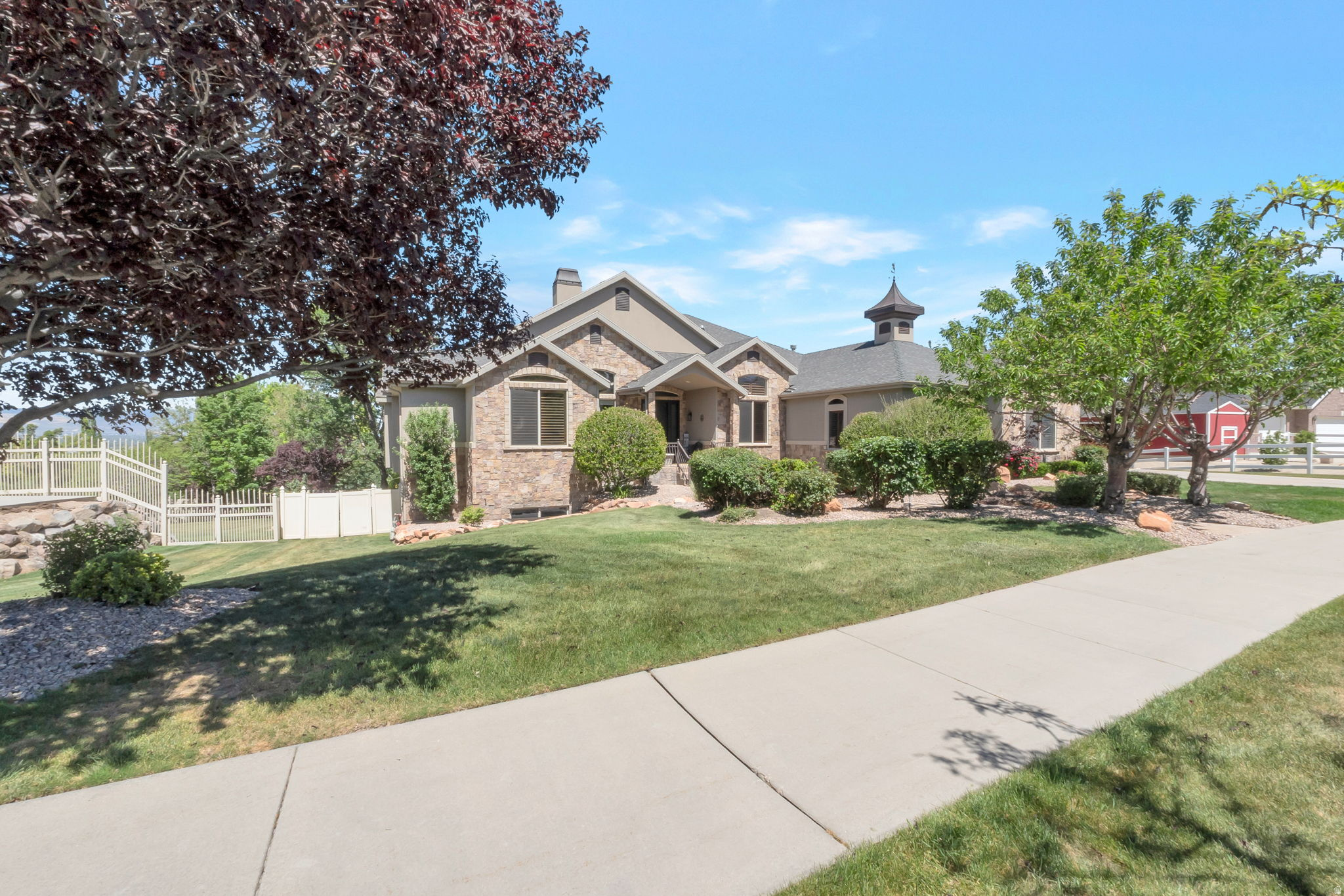 This beautiful Draper estate offers something rare - space and flexibility for the whole family. With a full private apartment/suite on each level, four kitchens, large master suite, and three laundry rooms, multigenerational living has never felt so effortless. The gourmet kitchen and wraparound deck frame breathtaking Salt Lake Valley views, while the walk-out basement delivers the ultimate hangout space. Tucked between two beloved Draper trails, with a 5-car garage and main-level living, this home is as practical as it is beautiful.  Pool is an added bonus. Owner/Agent