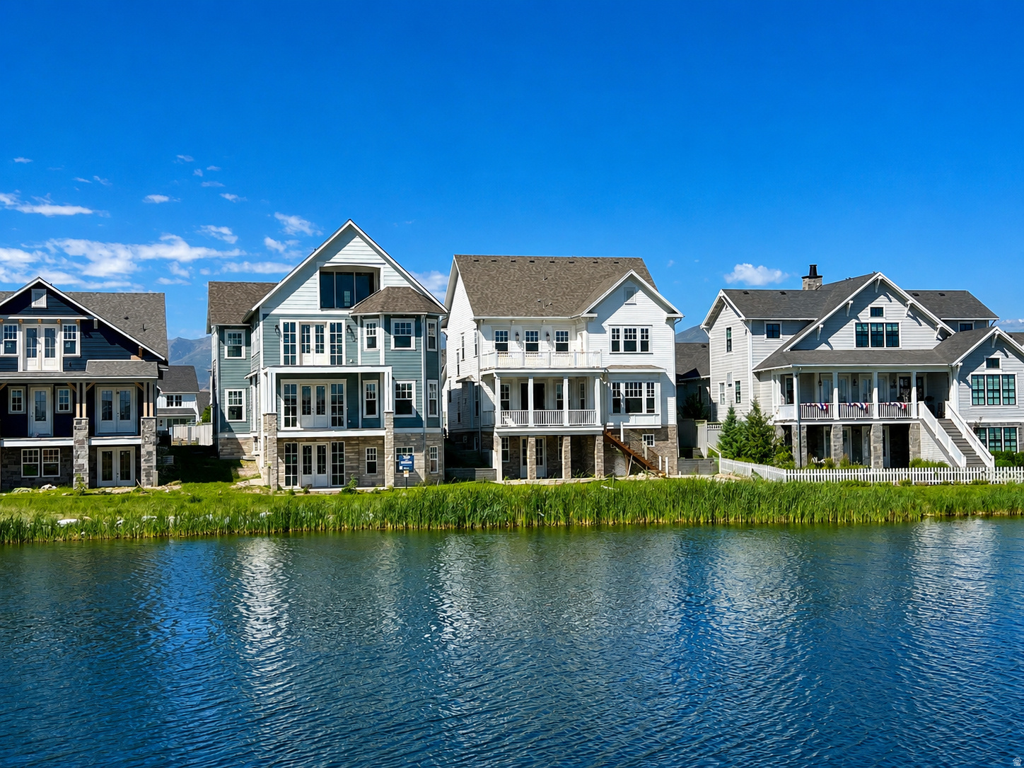 This water front new home is under construction but will be complete by the end of July 2026. This home features a gourmet kitchen w/Monogram appliance package. Walk out basement with wet bar. Deck off the Primary Suite with amazing east facing views.