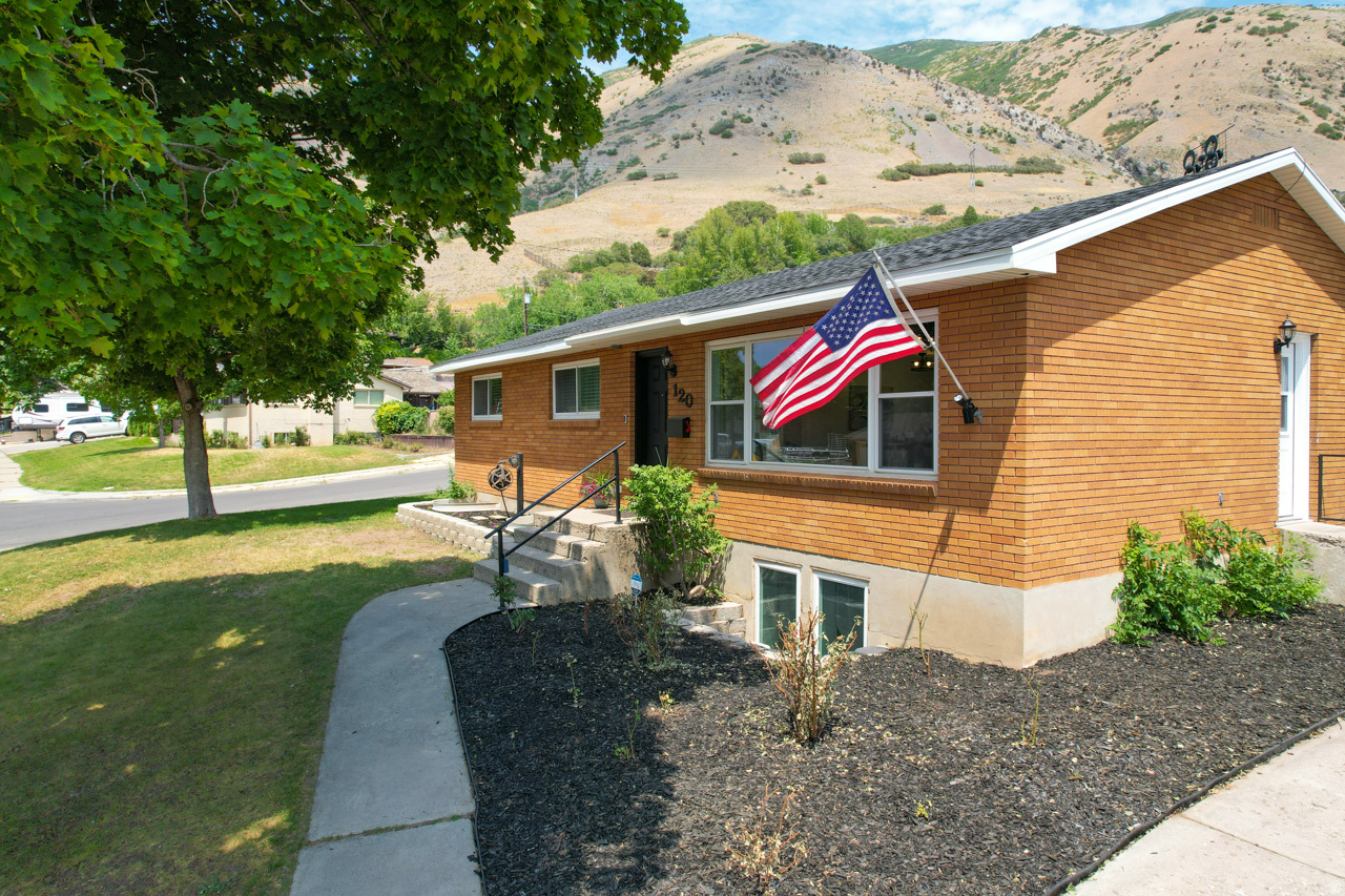 Fully remodeled Springville bench home on a spacious 0.34-acre lot with exceptional parking, storage, and workshop potential. Originally built in 1959, the interior has been extensively rebuilt from the studs, combining established-home charm with modern finishes and major system upgrades. Improvements include a new roof, furnace, central air conditioning, water heater, full electrical system, new plumbing, and new electrical service from the utility pole. The updated floor plan offers four bedrooms, three full bathrooms, a private primary bathroom, and a versatile den. The all-new kitchen features granite countertops, ceramic tile flooring and new appliances. Additional interior upgrades include new carpet, fresh paint, updated bathrooms, fixtures, and finishes throughout. Outside, the large lot provides abundant RV parking and space for multiple vehicles, trailers, recreational equipment, or future outdoor improvements. The oversized, high-clearance covered carport is ideal for a mechanic, workshop, boat or RV storage, and well-suited for future enclosure. A distinctive Springville property offering a comprehensive renovation, generous land, extensive parking, and outstanding utility.