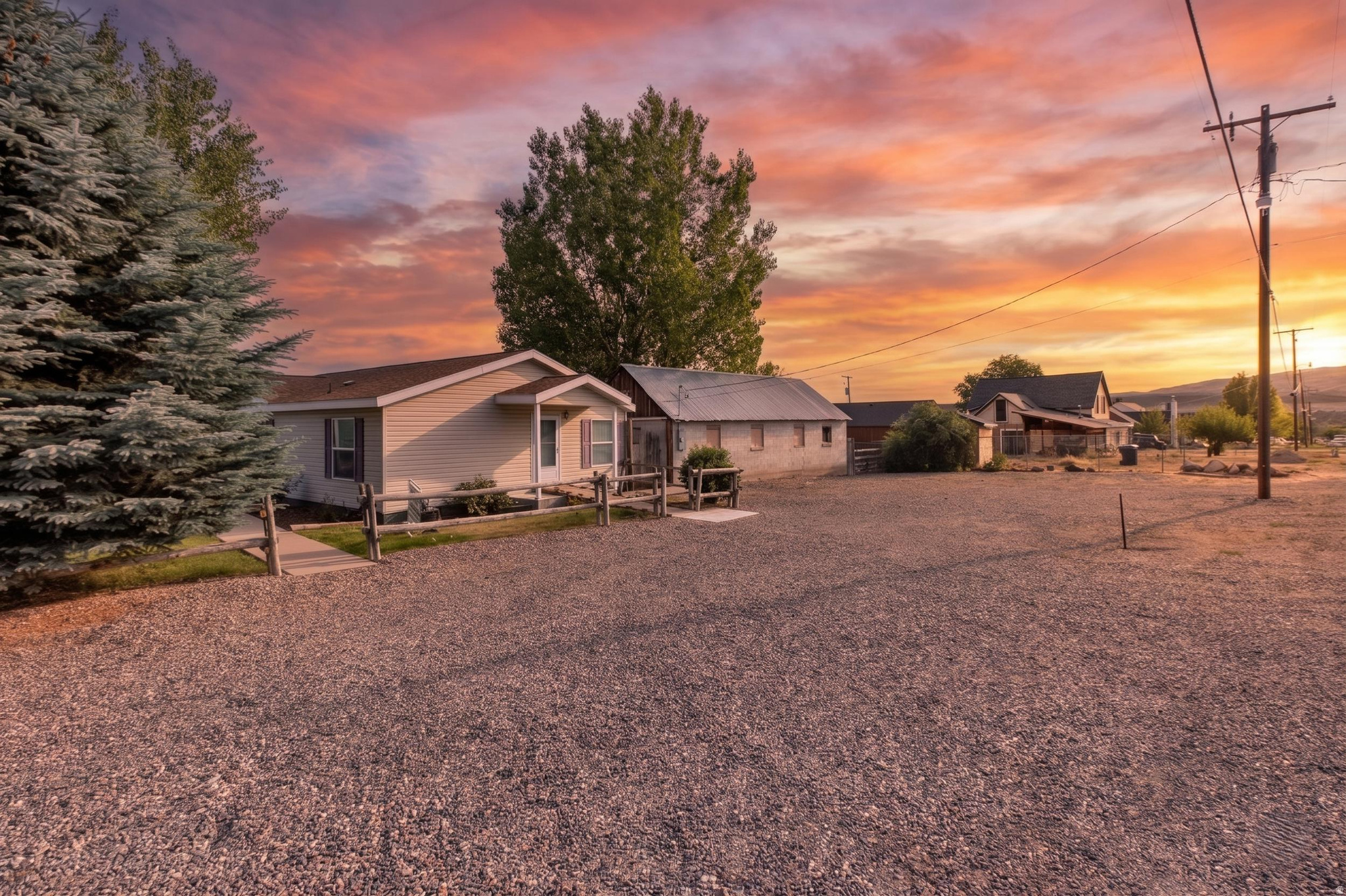 Great Affordable modular house with nice open floor concept. 3 Bedrooms 2 bathrooms. Large living room, featuring a good sized kitchen. Appliances are included with the house. Nice private yard, with a vegetable garden area, irrigation water sprinkler system (1 share of cottonwood gooseberry water included). Covered RV parking area measuring 12 ft by 25 ft. There is a covered patio area for entertaining your friends and family. This property also has a storage shed and old milk barn, which is now a converted shop, and storage area for your outside items. Come take a look at this one, its move in ready.