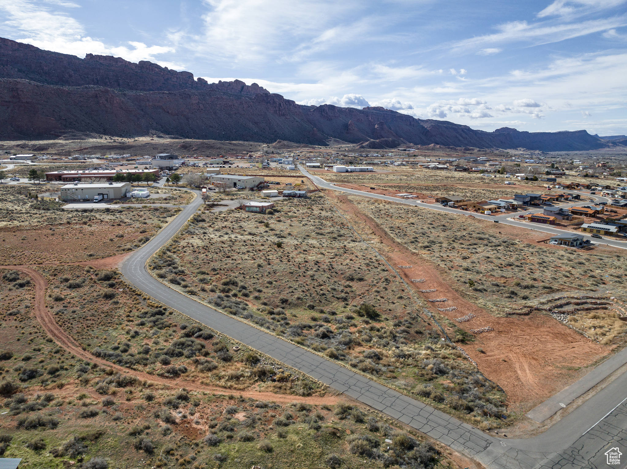 Premier Commercial Lot located in Moab's Strategic Growth Corridor. Secure your place in McKnight Commercial Subdivision-perfectly located and just minutes from downtown Moab. Zoned General Business (GB), this subdivision offers unmatched versatility for commercial use, accommodating retail, office space, services, and more. Prime Location: Positioned between HWY 191 and Spanish Valley Drive, only three miles south of downtown, providing exceptional accessibility and visibility. Broad Use Zoning: General Business zoning supports diverse commercial opportunities, making these lots ideal for a variety of innovative business concepts. Limited Availability: Only 9 lots remain out of the original 17. Development-Ready: Road and critical utilities-water, sewer, power, telecom-are fully established, enabling immediate development. Take advantage of this opportunity to be part of Moab's Limited Commercial Landscape.