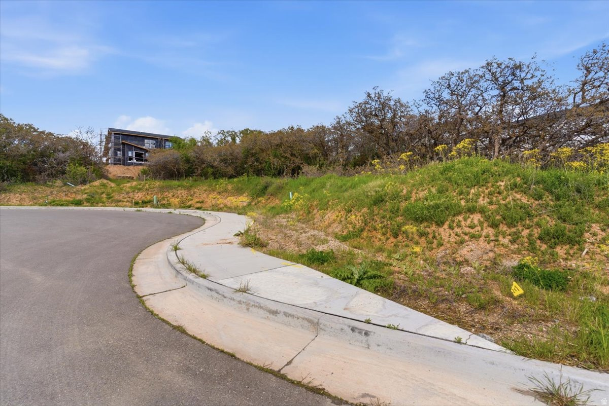Bring  your own builder and build your new home in beautiful South Ogden. Nestled up by the mountain with stunning views of the Wasatch Front. The community features walking trails, and a large clubhouse for gatherings. Enjoy maintenance free living with close proximity to hiking trails, shopping and Weber State University.  This is the last single family lot left in this subdivision.