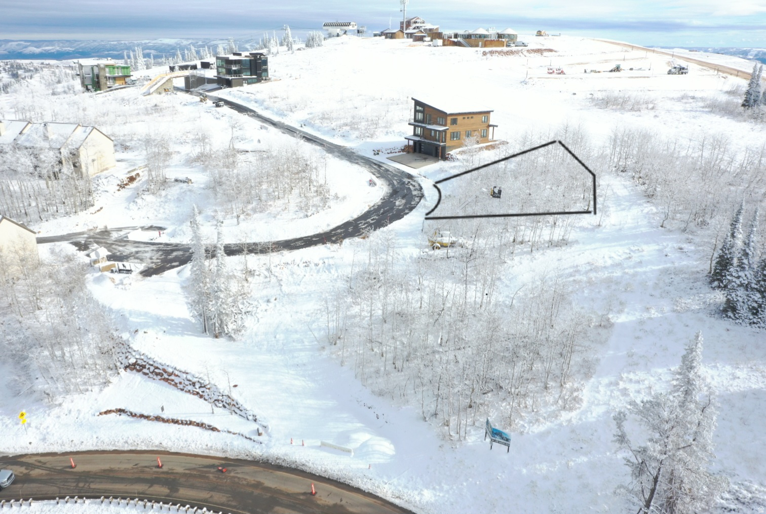 Few will claim a view like this as their legacy. Lot 15 at Aspen Ridge offers a rare opportunity to own a premier homesite within Phase 1 of this iconic Powder Mountain community. Set just below the Hidden Lake high-speed quad, this southwest-facing, gently sloped .17-acre homesite is ready to build and positioned at the summit near new resort development.  Aspen Ridge represents the original Powder Mountain adventure lifestyle-private, uncrowded, and authentic. From your future mountain residence, enjoy true ski-in/ski-out access, stepping directly into fresh powder with no lift lines and world-class terrain at your doorstep. The homesite boasts sweeping, unmatched views of Powder Mountain, Snowbasin, Ogden Valley, and the Great Salt Lake.  Powder Mountain is widely regarded as one of the most unique resorts in the country, offering both public and private communities while preserving expansive terrain and limited skier density. Lot 15 presents a rare opportunity to create a legacy mountain estate in one of North America's most uncrowded ski destinations-just one hour from Salt Lake City International Airport. Seller intends to complete a 1031 exchange and has agreed to pay all HOA dues and property taxes through closing.