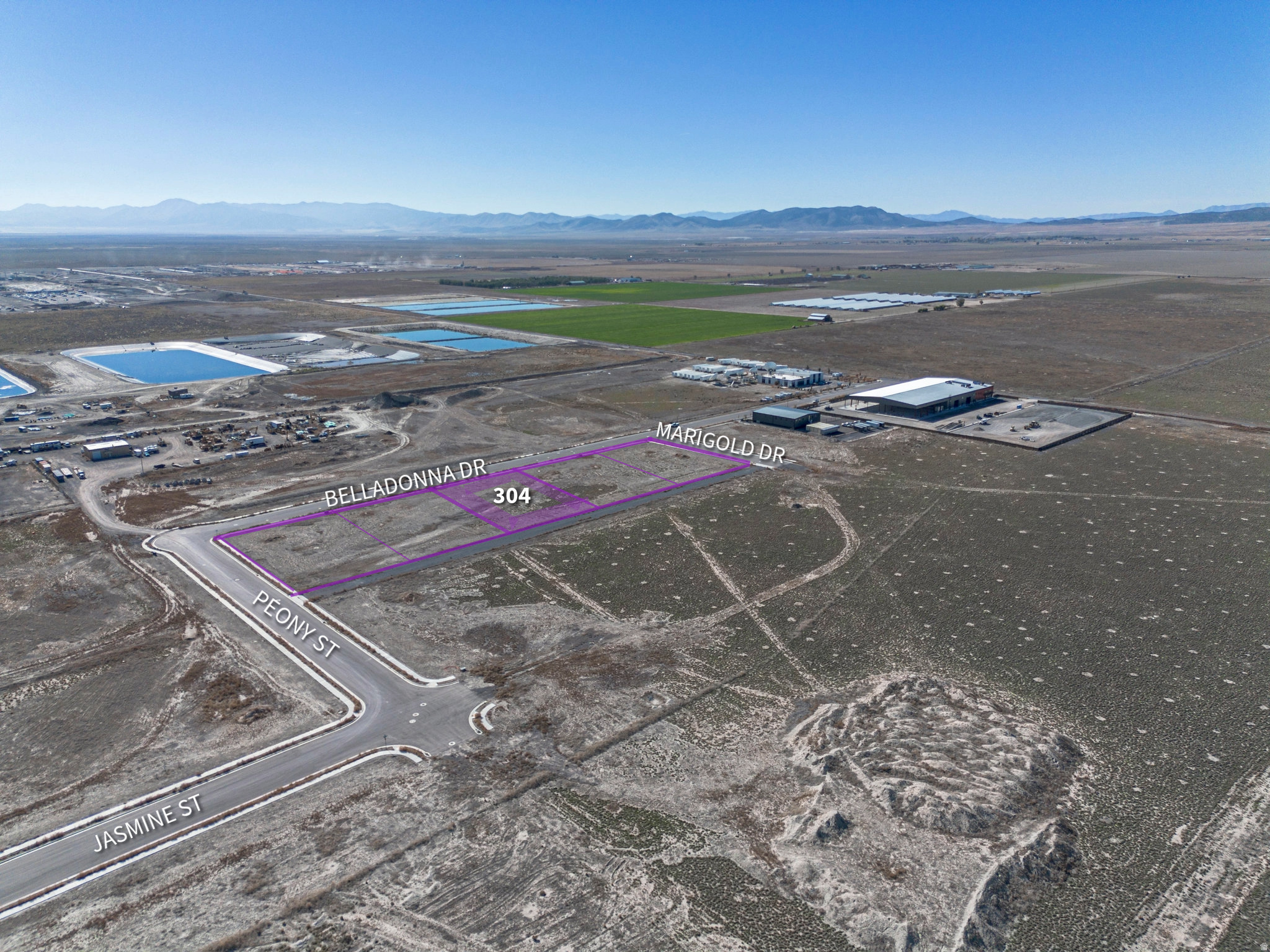 This 0.87-acre industrial land parcel is located in the Sweetwater subdivision, Lot 304, with an IND zoning classification. The property is situated at 1239 E Belladonna Dr in Utah County, UT 84005. The parcel is equipped with connection access to gas, power, sewer, and water utilities. Additional features include sidewalks, curb and gutter, mountain views, and valley views. The terrain is flat and the property is in an equestrian-accessible area. This offering represents a compelling opportunity for industrial development or investment.
