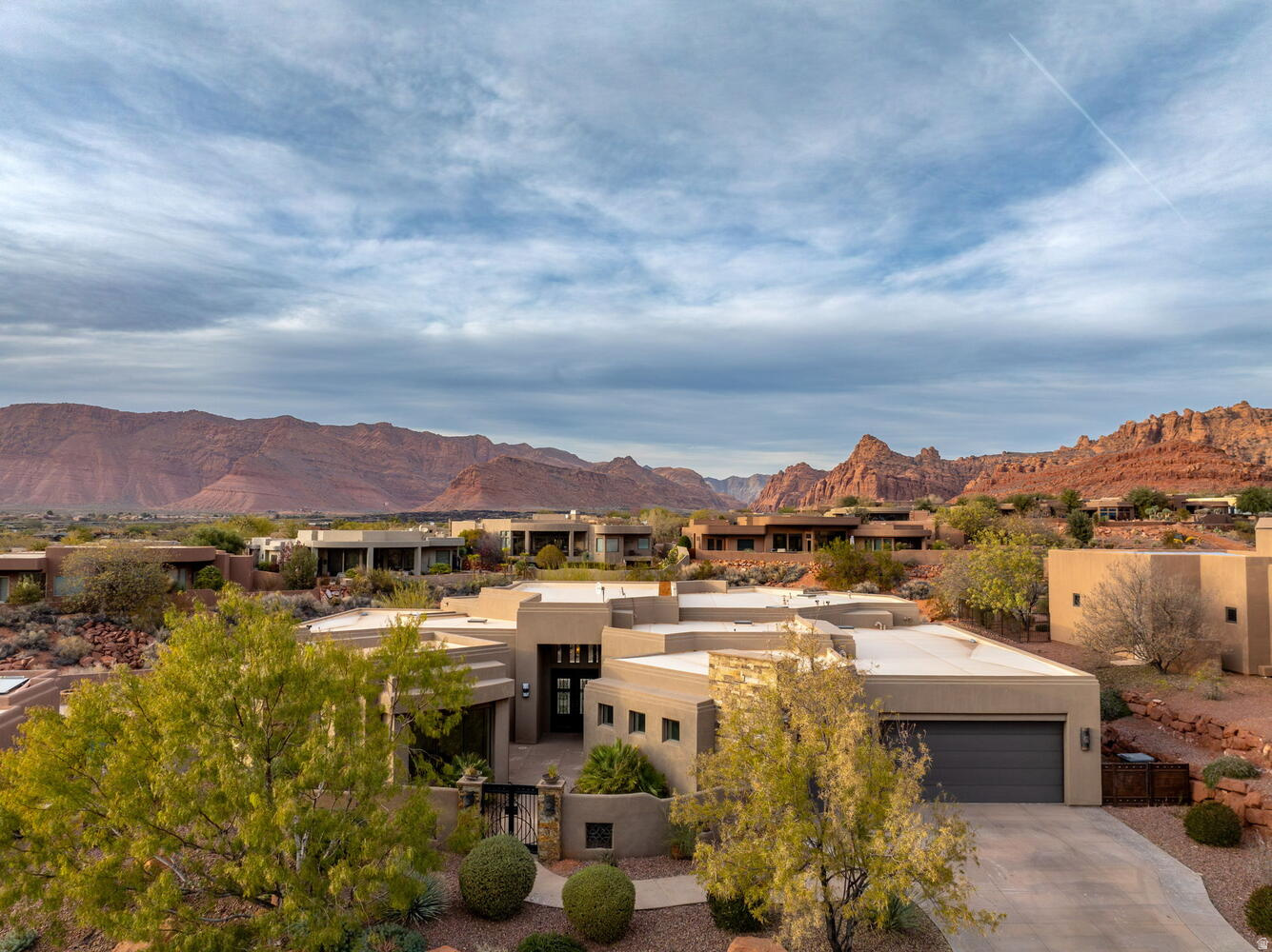Compelling opportunity in the Cliffs of Snow Canyon. Set in one of the area's most desirable gated communities, this property offers a rare chance to secure a home with views, privacy, and space at an attractive value.  Situated on a .35-acre lot backing to open space, the home enjoys beautiful scenery and a natural buffer from neighboring properties. The property includes 3 bedrooms, 4 baths, and a detached casita suited for guests or a private office.  The kitchen features high-end appliances, custom cabinetry, and a large island, while expansive windows bring in natural light and connect the home to its surroundings.  Outdoor living is highlighted by an in-ground pool and hot tub positioned to take in the views. An oversized 5-car garage adds flexibility for vehicles, storage, or hobbies.  Properties with this combination of setting, privacy, and location rarely come to market at this value level. A unique opportunity to secure a foothold in one of the area's most sought-after communities.