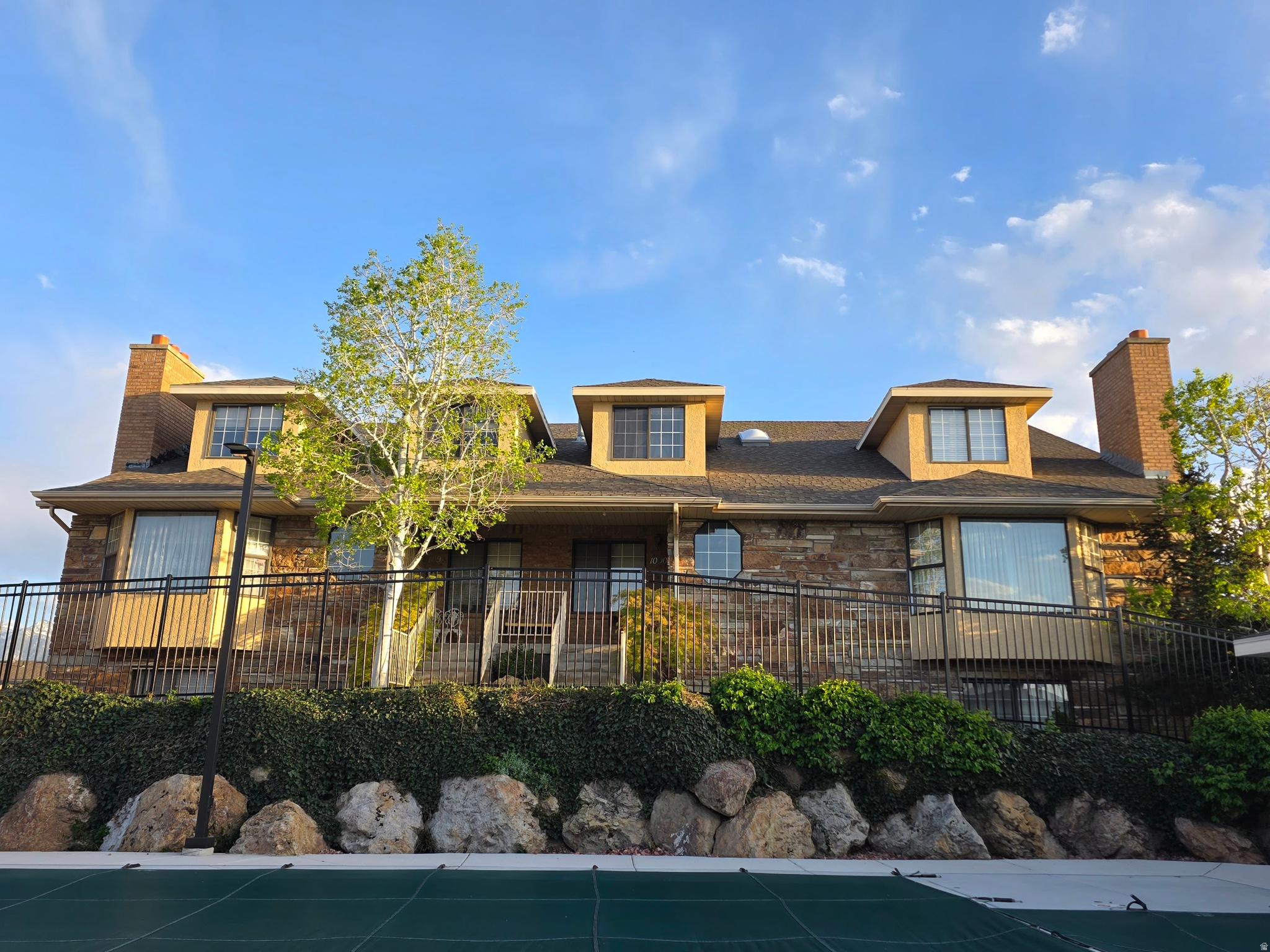 Welcome to an exceptional opportunity in the highly desirable Millcreek/Holladay area! Offering one of the most competitive prices per square foot in the surrounding market, this spacious and versatile townhome provides tremendous potential for a buyer looking to personalize a home and build value. The generous floor plan features four bedrooms, two kitchens, a rare three-car garage, and a large bonus room-ideal for entertaining, recreation, a home office, or an additional gathering space.  Enjoy beautiful mountain views and a peaceful view overlooking the community pool. Conveniently located less than 15 minutes from downtown Salt Lake City, with easy freeway access and only 20 minutes from the nearby canyons, this property combines space, flexibility, location, and outstanding value. With its impressive square footage and endless possibilities, this is an opportunity you do not want to miss.   Buyer and buyer's agent to verify all information.