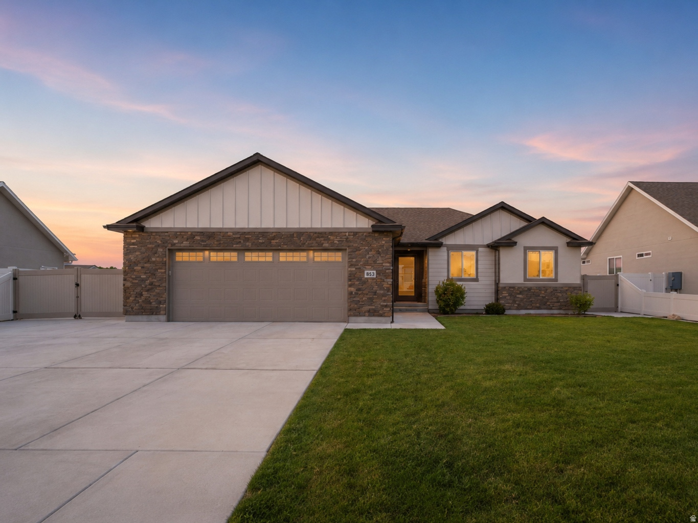 Discover the kind of home that embodies everything buyers love about Grantsville; space, functionality and a lifestyle that's becoming increasingly difficult to find. From the moment you arrive, pride of ownership is evident in every square inch of this meticulously maintained rambler, where thoughtful care and attention to detail are apparent throughout.  Designed for convenient main-level living, this home features soaring vaulted ceilings, abundant natural light and a spacious floor plan that feels both open and inviting. The well-designed layout includes a private primary suite with an ensuite bathroom, two additional bedrooms, an additional full bathroom and a practical mudroom that helps keep daily life organized.  One of the standout features is the oversized 3-car garage, offering ample space for vehicles, tools, and hobbies, while still leaving plenty of room on the property for RV parking, trailers, recreational vehicles and all the outdoor toys that come with Utah living.  The generous lot is further enhanced by secondary water, a highly desirable and valuable feature that helps keep landscaping costs down while providing the flexibility to maintain lush lawns, gardens and outdoor spaces with ease.  Downstairs, the unfinished basement offers a blank canvas with incredible potential to add additional bedrooms, a home gym, theater room, office, or entertainment space tailored to your needs.  Step outside and enjoy a backyard designed for making memories, complete with your own private pickleball court and plenty of room for summer barbecues, family gatherings and outdoor entertaining.  Located in a community known for its small-town charm, wide-open spaces, and outdoor lifestyle, this exceptional property offers the perfect combination of comfort, recreation, and room to grow. If you've been searching for a home that delivers true main-level living, exceptional parking and storage, secondary water and the pride of ownership that's rarely found, this Grantsville gem deserves your attention.