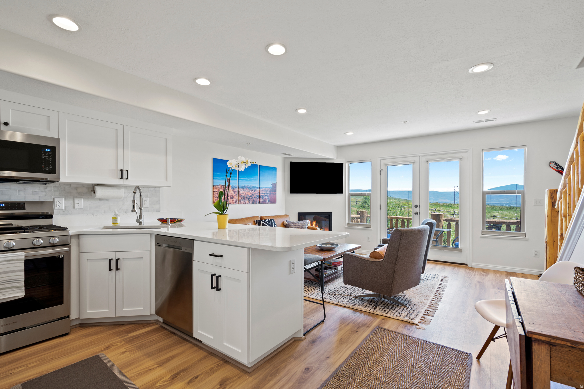 Don't miss out on this beautiful, FULLY FURNISHED 2BR/2BA condo that was completely remodeled in 2023. With all new cabinets, countertops, appliances, flooring, fireplace, and bathrooms. This bright, airy condo set itself apart from other units in the community. The front and back balconies have breathtaking views of the mountains and Pineview Reservoir. The upper floor features a large primary bedroom and full bathroom, with new stackable LG washer and dryer and additional storage. The HVAC system was replaced in early 2025. The ski bus stop at up the road that will take you to Powder Mountain, and you are just minutes from Nordic Valley and Snowbasin ski resorts by car. Enjoy the summer on Pineview reservoir, and miles of hiking and biking trails. Or just relax at the community pool, hot tub, and clubhouse. Moose Hollow is also zoned for nightly or long-term rentals. This is one of the most updated condos to come available in this complex for quite some time!