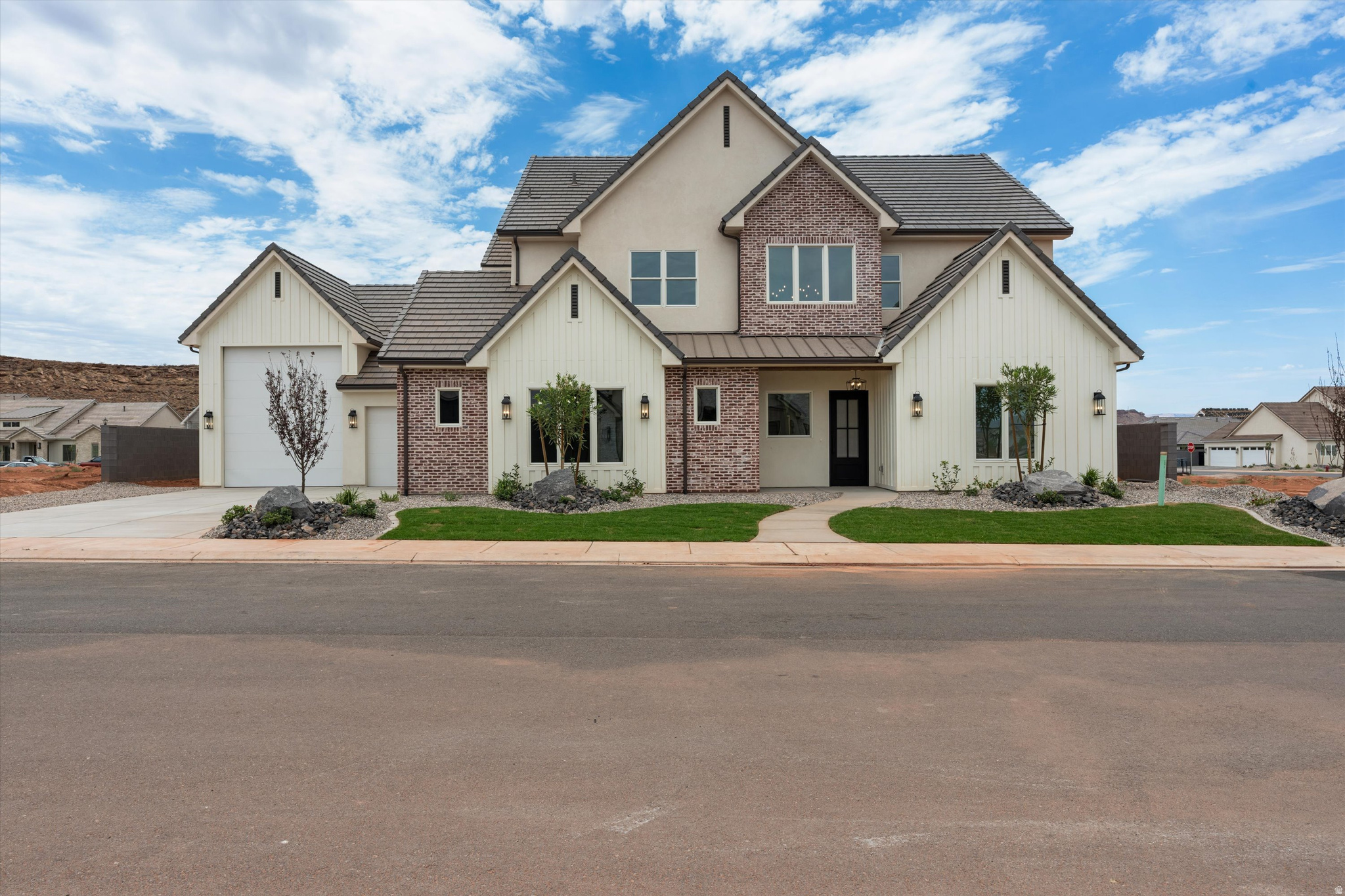 5 Bed + Loft + Theater + RV Garage + Toy Garage! This brand new home in the desirable Finley Farms subdivision features 4 full bathrooms, high end finishes, and detailed craftsmanship throughout. The open living room features a beautiful gas fireplace, while the main floor primary suite offers dual sinks, a soaking tub, a separate walk in shower, and a large walk in closet. Upstairs, you'll find a huge loft with mountain views and a separate theater room wired for speakers, along with an oversized storage room perfect for holiday decor or a playroom. Two laundry rooms provide added convenience, with one serving the two downstairs bedrooms and the other serving the remaining three bedrooms upstairs. The impressive garage setup also includes a 27 foot deep 2 car garage large enough to accommodate trucks and a 14 foot deep toy garage perfect for a RZR or golf cart.