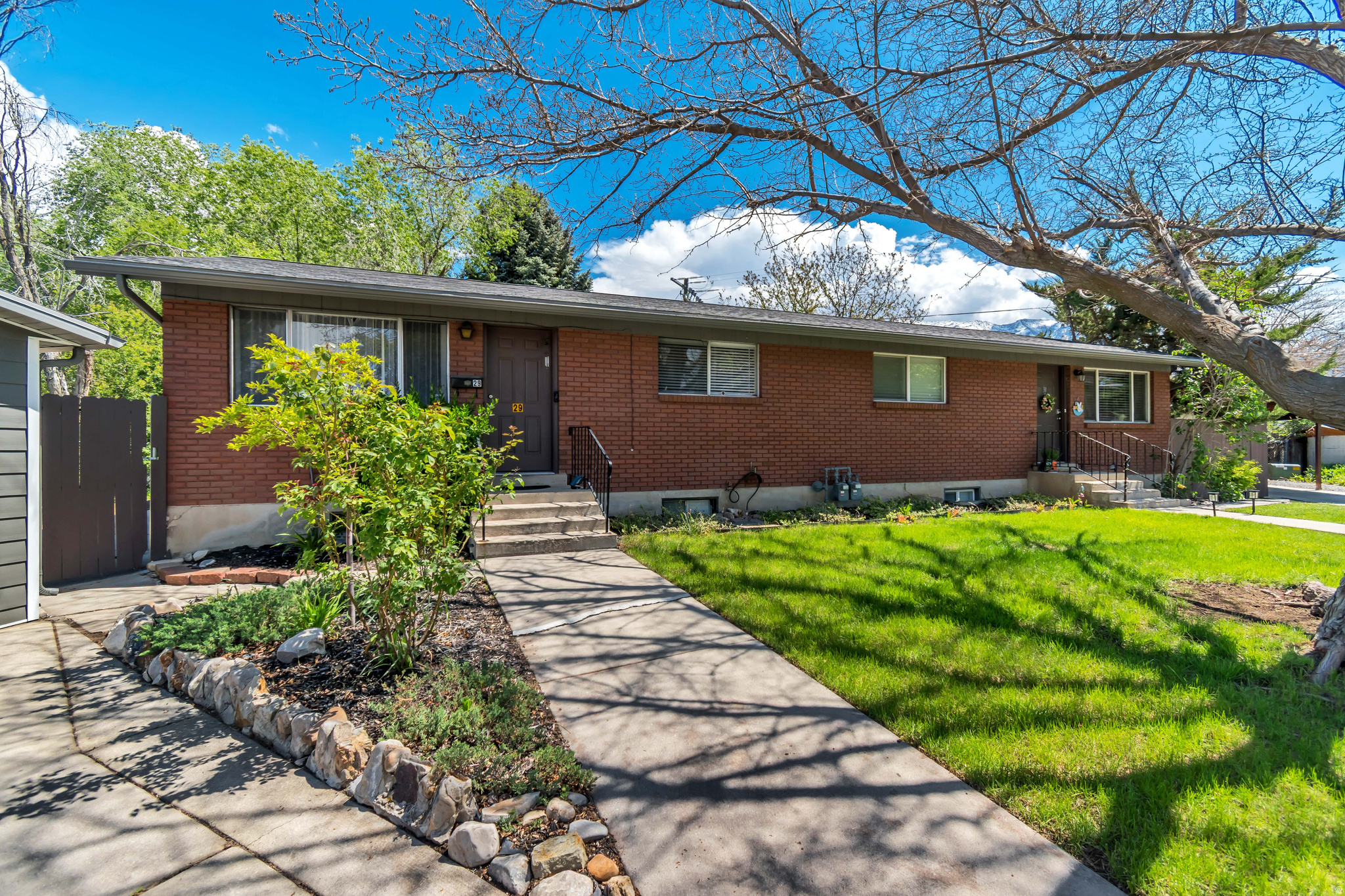 A legal side-by-side duplex in Orem with strong fundamentals for the long-term investor or savvy owner-occupant. Each unit offers 4 beds and 2 baths across 1,769 sq ft - spacious enough to attract quality, stable tenants. Unit 1 comes with a detached 2-car garage; Unit 2 has a 2-car carport - a meaningful perk in a market where parking matters. Classic brick construction, LVP flooring, and mature landscaping keep maintenance predictable and curb appeal solid. Current rents of $1,800 and $1,750/month with utilities largely tenant-paid. No HOA. Eligible for cash, conventional, and FHA financing. Live in one, rent the other - or hold both and let Orem's steady rental demand do the work. **BOTH LEASES EXPIRE OCTOBER 15TH, 2026.