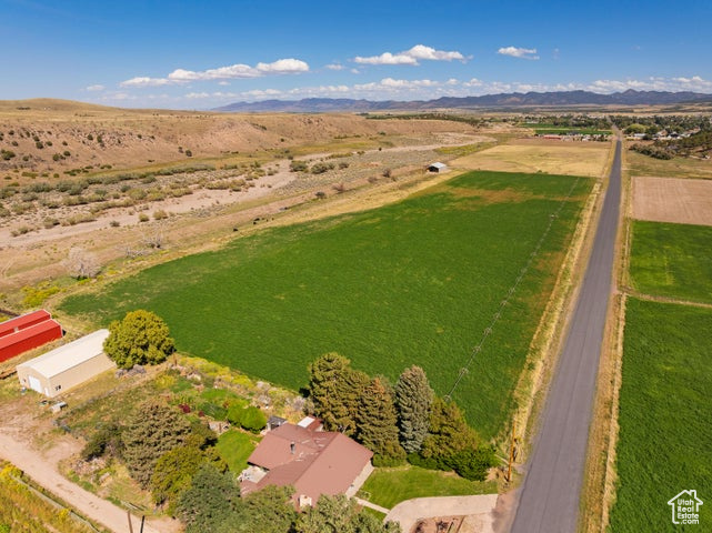 181.77 acres for sale in city limits in Enterprise, UT. Currently being farmed. Includes 230 shares of Enterprise Reservoir and Canal Company. Water shares are being used to irrigate Southwest 15 acres of land currently. Southeast 30 acres are currently set up for dry farming/grazing. Power is located on the property. Hay barn (85x55) and wheel lines are included in the sale. Currently being assessed in Greenbelt for taxes. Build a residential home and keep farming the land. Other possibilities include developing a residential subdivision with 45 acres on the South flat land. Developers would have to bring city utilities from the nearest connection to the property. So many different ideas and opportunities with this land. Come and see it.