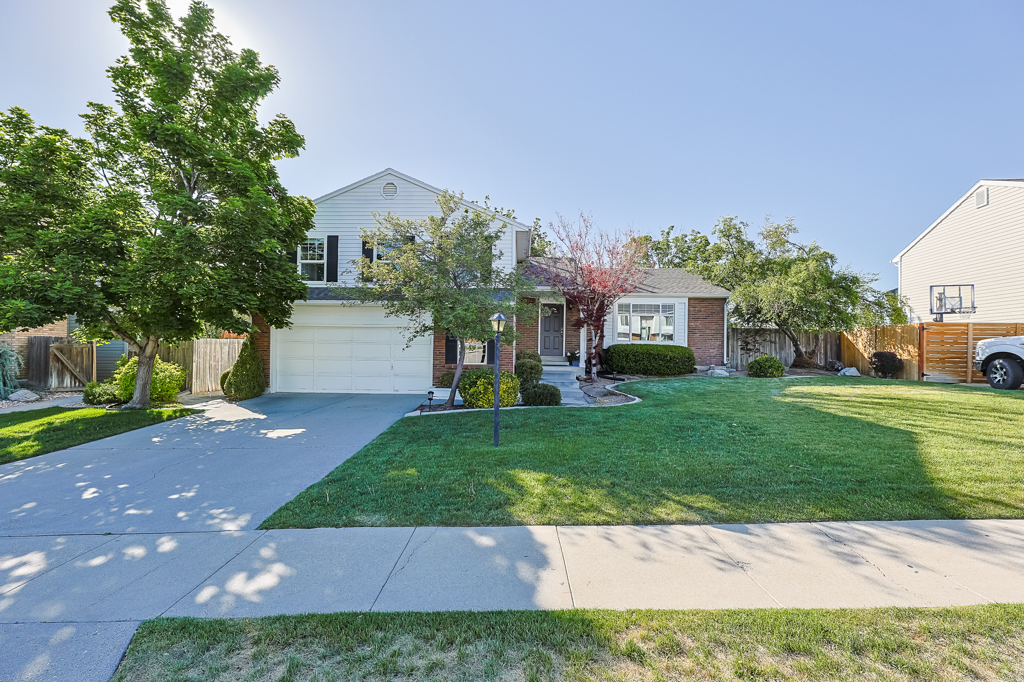 Fantastic home nestled on the desirable east bench of Sandy! This move-in-ready property features fresh paint, new carpet, and major system updates, including a new HVAC system and water heater (2025) and a newer roof (2021). The updated kitchen and nice living spaces, perfect for everyday living and entertaining. Enjoy the spacious deck overlooking a beautifully landscaped yard with mature trees, offering privacy and charm. Ideally located near top-rated schools, scenic hiking and biking trails, and world-class skiing. Convenient access to Silicon Slopes and a quick commute to downtown Salt Lake City. Buyer to verify all information.