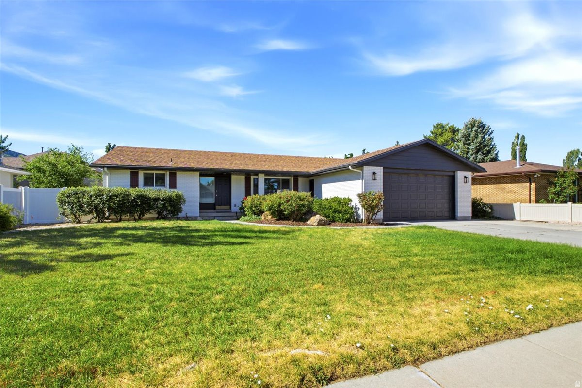 Recently updated all-brick rambler offering space, flexibility, and comfort for today's lifestyle! This spacious home features 5 bedrooms, 3 bathrooms, two inviting living areas, and two full kitchens, making it an ideal setup for multi-generational living, extended family, or guests.  The generous floor plan includes spacious rooms throughout, plus a versatile flex room (with a closet but no window) that's perfect for a home office, fitness room, hobby space, playroom, or whatever best fits your family's needs.  Situated in an outstanding neighborhood with beautiful mountain views, this home is conveniently located near schools, ski resorts and Hidden Valley Country Club. Outside, you'll appreciate the RV parking and ample space for all your vehicles and recreational toys.  Don't miss this exceptional opportunity to own a move-in-ready home that combines versatility, comfort, and a fantastic location!
