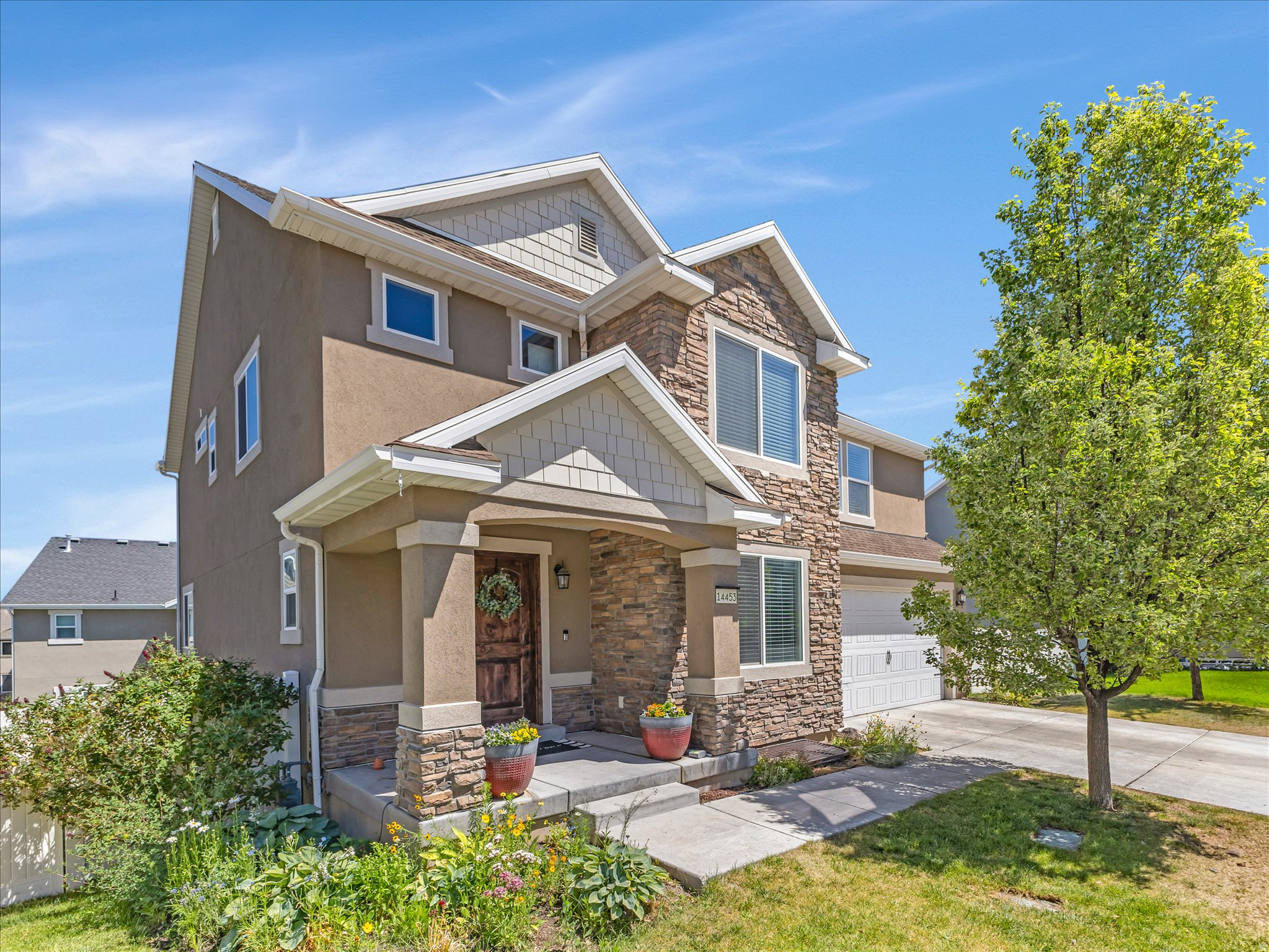 Exceptionally large lot (.17 acres) for the area is the standout feature of this spacious home on the east side of Herriman! Located in a quiet community with fast Mountain View Corridor access, this well-upgraded home features new carpet installed this week, quality cabinetry and countertops, an enormous pantry, and a convenient mud room. The open-concept floorplan has soaring ceilings up to the beautiful second story that fill the home with natural light. Upstairs you'll find 4 large bedrooms, including a massive primary suite with a huge walk-in closet, dual vanities, and separate tub and shower. The large composite deck is perfect for grilling. The walk-out basement leaves you with endless possibilities to make it your own.