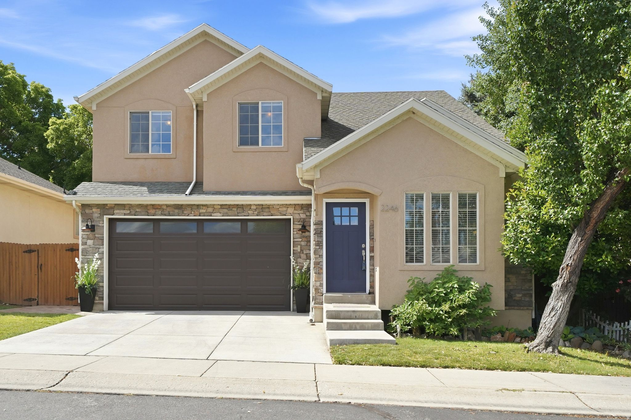 Nestled in a highly sought-after East Millcreek cul-de-sac, this beautifully maintained home offers the perfect balance of private, secluded living with urban convenience. Built by Brad Reynolds in 2000, this residence is located within a small, thoughtfully designed subdivision just off Evergreen Avenue, offering effortless, low-maintenance living within an exclusive, vibrant community.  Positioned directly across from the Millcreek Library and Evergreen Park, you will enjoy a quiet, peaceful neighborhood vibe with virtually zero traffic noise. Forget searching for parking during popular community events-you are just steps away from the Millcreek 4th of July parade, the Millcreek Arts Fest, and Venture Out Friday night movies in the park, all while enjoying quick access to both city and recreational amenities via I-80.  Major capital improvements offer ultimate peace of mind, featuring a brand-new concrete driveway, a new front door, and a new garage door that beautifully enhances both security and exterior aesthetic. Inside, the entire interior has been treated to fresh new, professional paint, creating a bright, cohesive, and modern backdrop.  Step into an inviting main level featuring soaring vaulted ceilings. The open-concept layout is anchored by a stunning, double-sided gas fireplace that connects the great room and dining room, casting a cozy ambiance whether you're hosting a dinner party or relaxing on the couch. Cooking and entertaining are a breeze in the spacious, updated kitchen, complete with a beautiful stone backsplash. A fully refreshed main-floor powder room features a brand-new vanity, toilet, and modern mirror.  The second floor features brand-new carpet underfoot, ensuring a plush, clean feel throughout the bedrooms. The spacious primary retreat boasts a walk-in closet, a spa-like ensuite bath with a jetted tub, and private balcony access.  Downstairs, the fully finished basement provides 700 square feet of versatile lower-level living space with an additional bedroom and bath-ideal for a second family room, media hub, home gym, or a private guest suite.  The fully fenced, secluded backyard is a gardener's dream and an entertainer's delight highlighted by a beautiful stamped and stained concrete patio. Two large, custom garden boxes plumbed with integrated drip irrigation, plus an automatic sprinkler system running along the fence line provide effortless, lush container gardening. As the sun sets, host dinner parties on the patio under the ambient glow of included cafe lighting.  At only $130/month, the HOA is practical, and highly efficient, run by neighbors who prioritize keeping costs down while maintaining excellent community standards. It covers essentials like lawn care, snow removal, and community insurance, giving you more time to enjoy your home and less time on weekend chores.  Square footage figures are provided as a courtesy estimate only and were obtained from county records .  Buyer is advised to obtain an independent measurement.