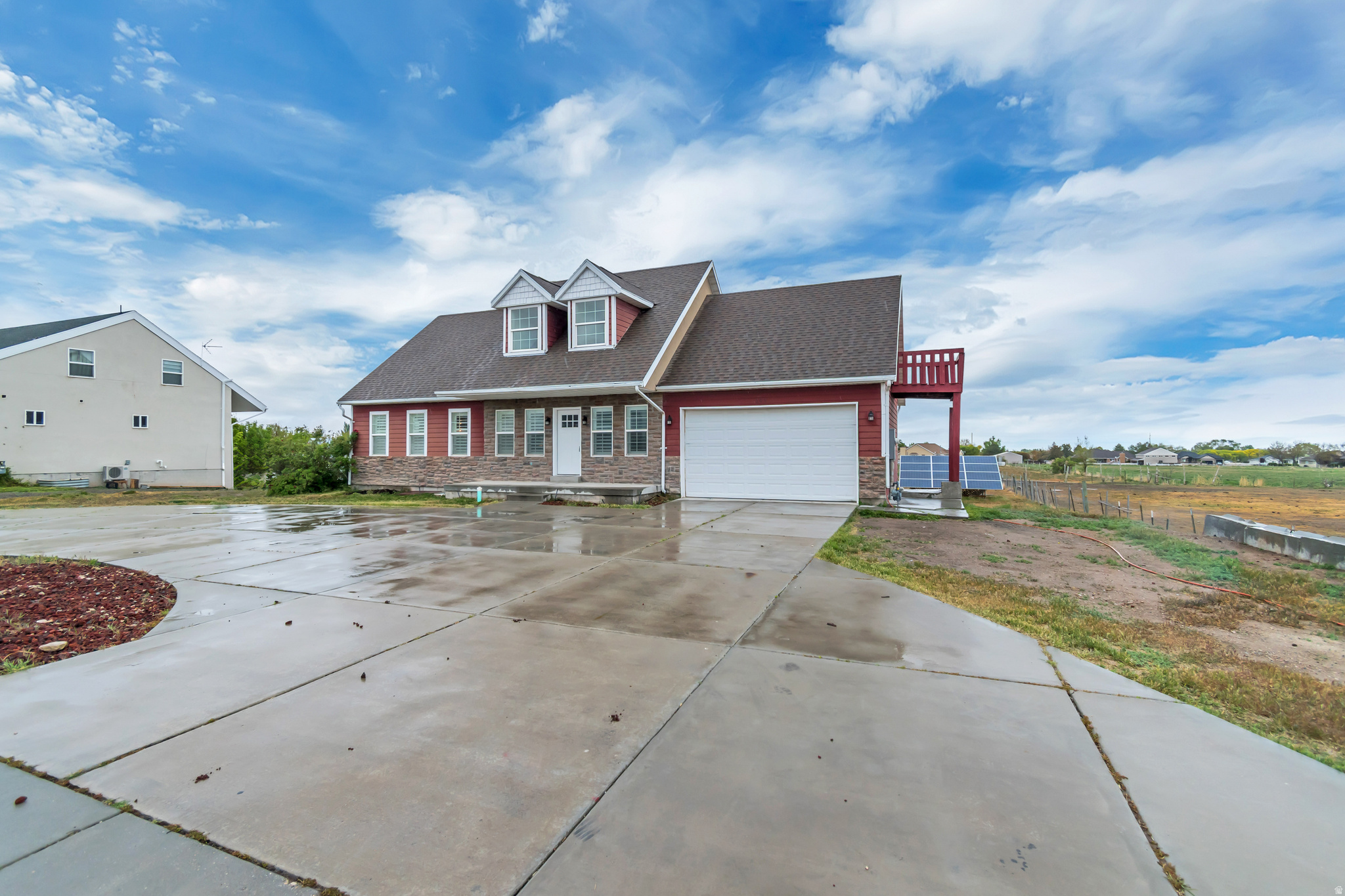 This beautifully remodeled home in Grantsville offers space, functionality, and modern updates throughout with no HOA. The main level features a comfortable master suite, along with a fully updated kitchen complete with stylish finishes and backsplash that flows naturally into the main living areas. The upper level offers a spacious open loft style room with a fireplace and private balcony, creating a perfect second living space, office, or retreat. Downstairs, the basement provides incredible flexibility with five additional bedrooms and two full bathrooms, along with a separate laundry area, making it ideal for larger households, guests, or multi generational living. The property also includes two large paid off solar panels, adding long term efficiency and value. Outside, enjoy a deck off the main level, a spacious yard ready to make your own, and a unique circle through driveway that offers convenience and plenty of parking. With its thoughtful layout and extensive updates, this is a rare opportunity in Grantsville. VACANT & EASY TO SHOW