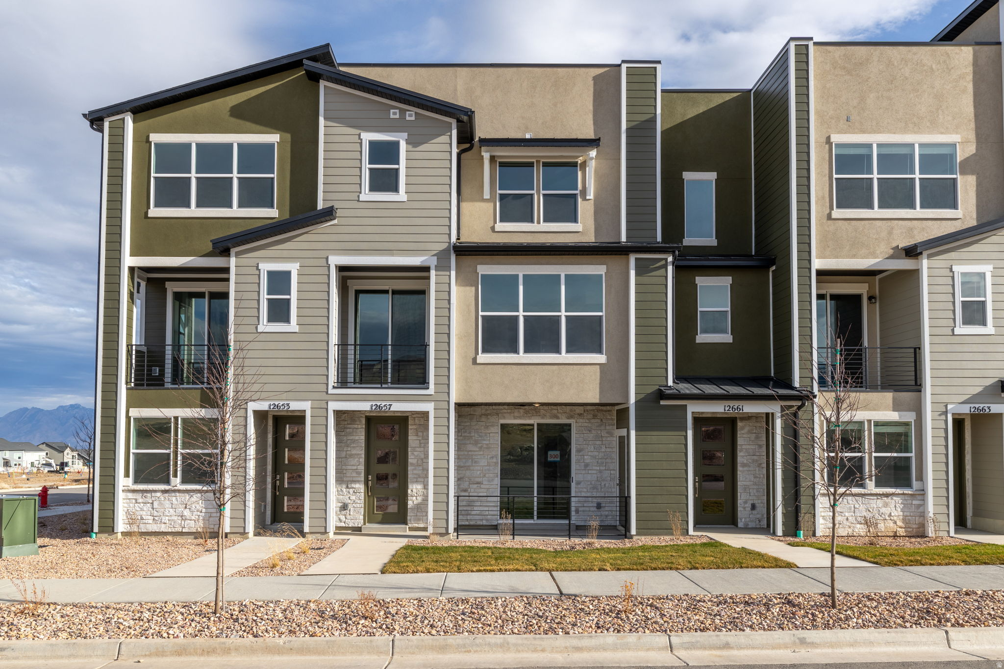 Welcome to Joshua Tree in Herriman, a vibrant townhome community where modern design meets effortless living. The Maui plan at Joshua Tree  a stylish 3-story townhome featuring 4 bedrooms, 3.5 baths, and 1,991 sq ft of thoughtfully designed living space. Enjoy modern finishes like quartz countertops, stainless steel appliances, and 9' ceilings, plus a private deck and smart 1-car garage. With energy-efficient features, a spacious primary suite, and landscaping maintained by the HOA, this home blends comfort, convenience, and low-maintenance living in the heart of Olympia.