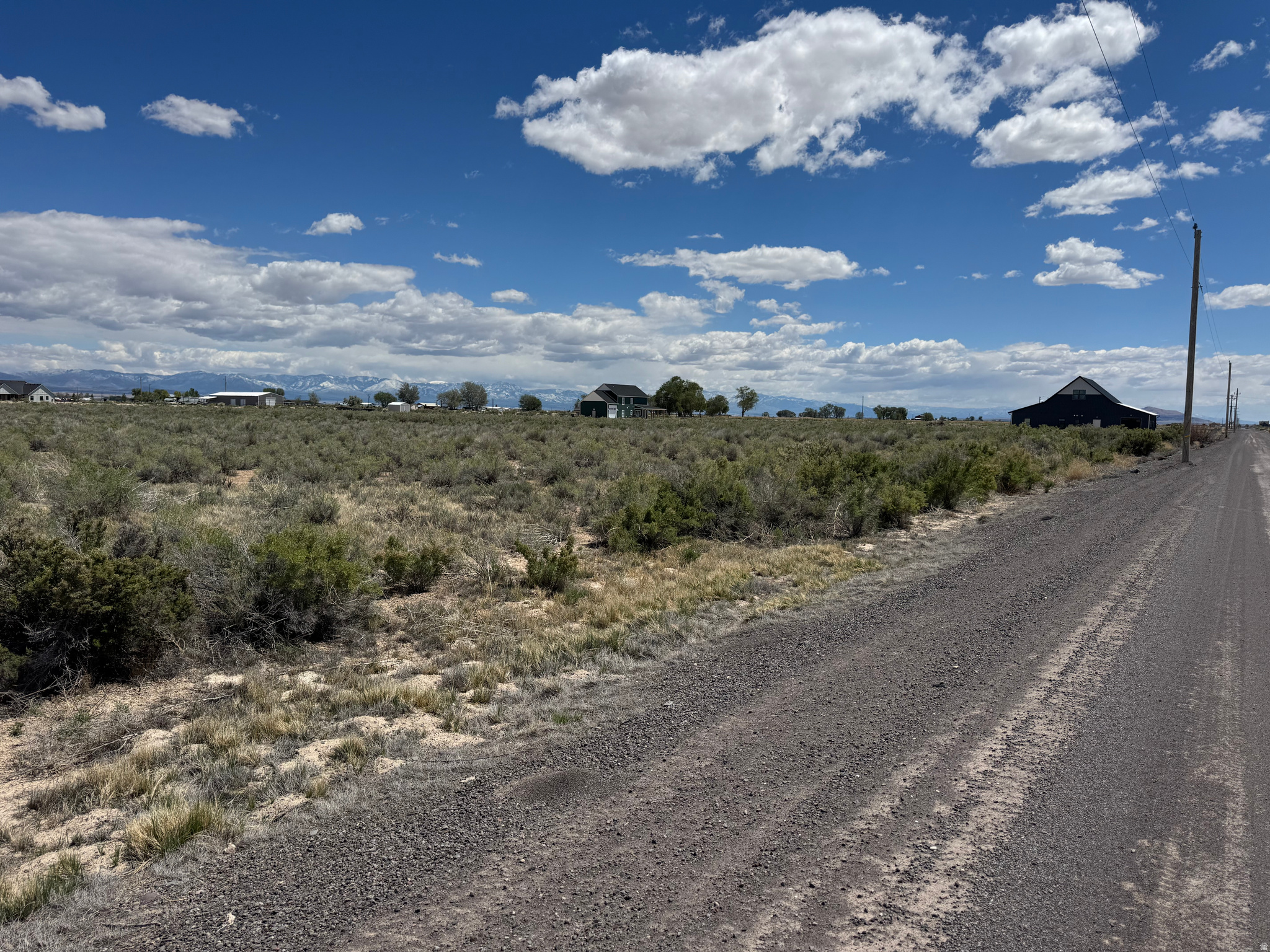 10.75 Ac lot on the outskirts of Delta. Additional 10.75 ac lot available to the north. Power in front along the road. Underground water rights are available to purchase from a separate seller. Zoned Ag1, so residential lots have to be a minimum of 1 acre. Some commercial uses allowed as well. Maps & address are approximate. Located on the east side of the road, so your frontage faces west.