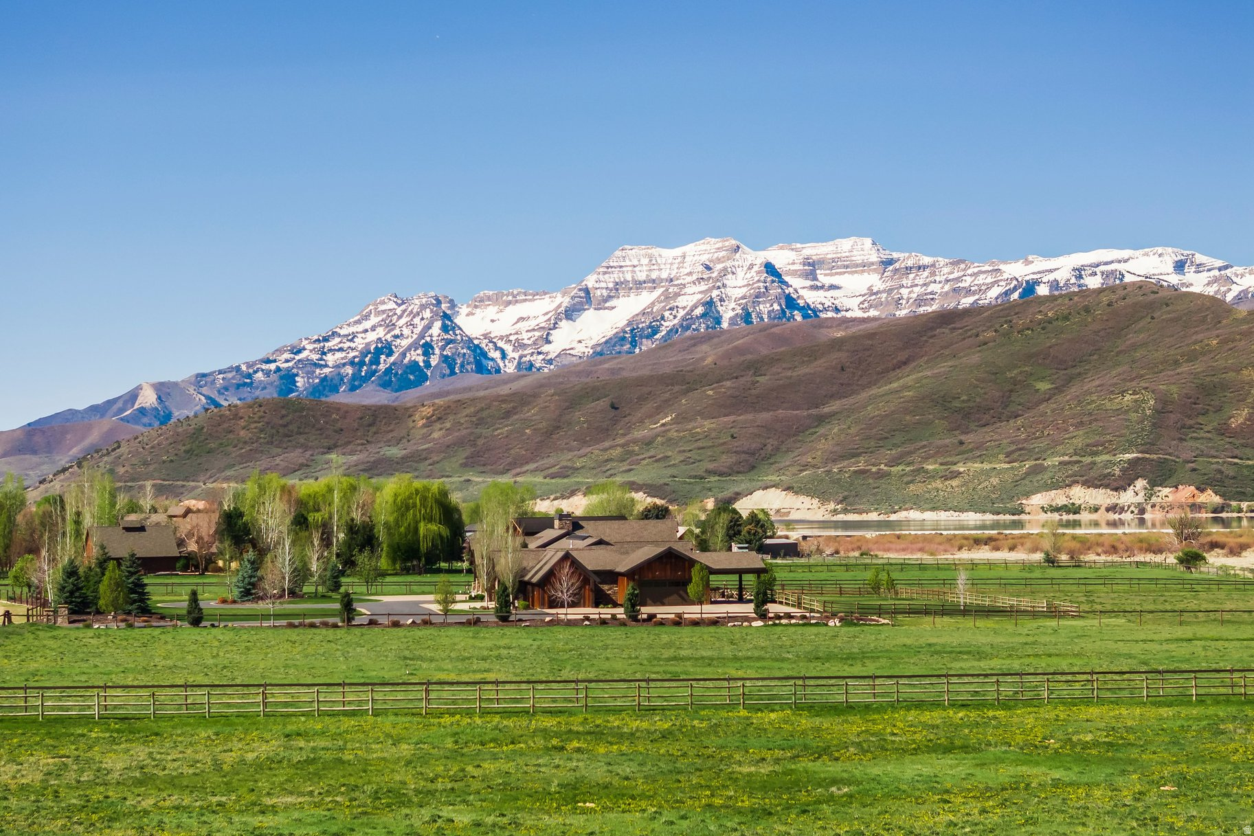 Opportunities like this are incredibly rare-one of the few properties in Wasatch County that backs directly to the Provo River, offering a unique combination of privacy, natural beauty, and year-round recreation. Set on 6.2 fully fenced acres in prestigious Winterton Farms, this quiet cul-de-sac setting provides the perfect backdrop to build your dream home. Enjoy the sights and sounds of the river just beyond your backyard, creating a peaceful retreat that's hard to find and even harder to replicate. Take in sweeping views of Soldier Hollow, a world-renowned Nordic venue that hosted cross-country skiing and biathlon events during the 2002 Winter Olympics and is set to play a key role in the upcoming Winter Olympics in Utah. The area continues to draw athletes and outdoor enthusiasts from around the globe, offering pristine trails and a rich Olympic legacy. The property also captures incredible, unobstructed views of the Wasatch Back, including the iconic Mt. Timpanogos-delivering stunning sunrises, glowing sunsets, and ever-changing mountain scenery in every direction. All of this, while being just minutes from the amenities of Park City, Midway, and Heber, with easy access to world-class skiing, blue-ribbon fishing, championship golf, ATV and hiking trails, and a growing selection of local restaurants and shops.