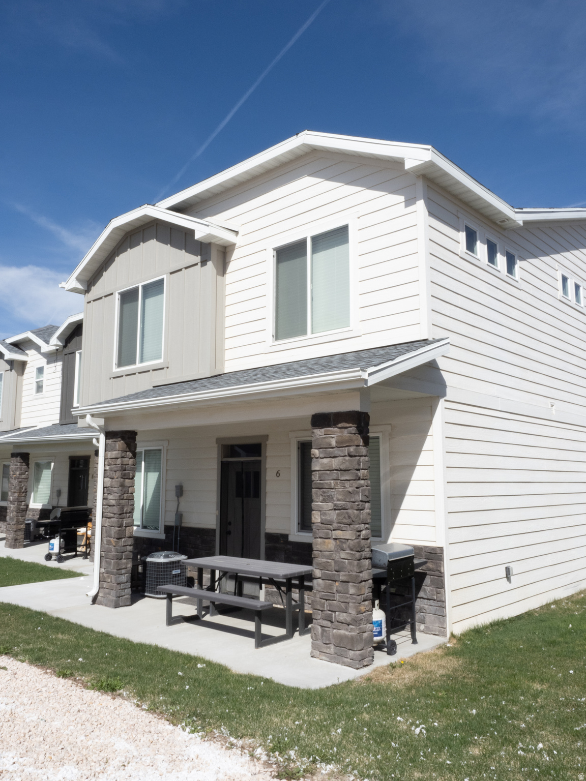 Tucked into the desirable Seasons community in beautiful Garden City, this 2022-built turnkey property is anything but ordinary - it's two income streams under one roof, just minutes from the turquoise waters of Bear Lake. Whether you're an investor hunting for cash flow, a savvy buyer wanting your vacation home to pay for itself, or a family searching for the ultimate Bear Lake basecamp, this one checks every box. The upper level lives like its own retreat with four bedrooms, two full baths, and a bright, open layout perfect for gathering after a day on the water. Downstairs, the main-floor unit offers two more bedrooms and its own full bath - a fully self-contained space that's been earning consistently as both a short-term Airbnb rental and a long-term lease. That's two doors, two income streams, and double the flexibility to live in one and rent the other, or simply let both sides keep working for you. With 2,038 square feet of finished living space across six bedrooms and three bathrooms total, there's room for everyone - and then some. Every detail feels fresh and modern thanks to the 2022 build, meaning no deferred maintenance and no surprises. Just move in (or list it) and start enjoying. And then there's the location. Bear Lake's sandy beaches, boating, paddleboarding, and legendary raspberry shakes are practically at your doorstep, and the property includes coveted trailer parking - a rare and seriously valuable perk for anyone hauling boats, jet skis, snowmobiles, or RVs to play on the lake and in the surrounding mountains year-round. Summer on the water, fall colors in the canyons, winter sledding and snowmobiling, spring hikes - Garden City delivers all four seasons in style, and so does this home. Properties like this - newer construction, dual-income, walkable-to-Bear-Lake, with trailer parking - don't come along often in this market. Whether you're building a portfolio or simply ready to make memories at the lake while your investment works for you, 150 Seasons Loop #6 is the rare opportunity that pays you back. Schedule your showing today (24-hour notice required for our wonderful guests and tenants).