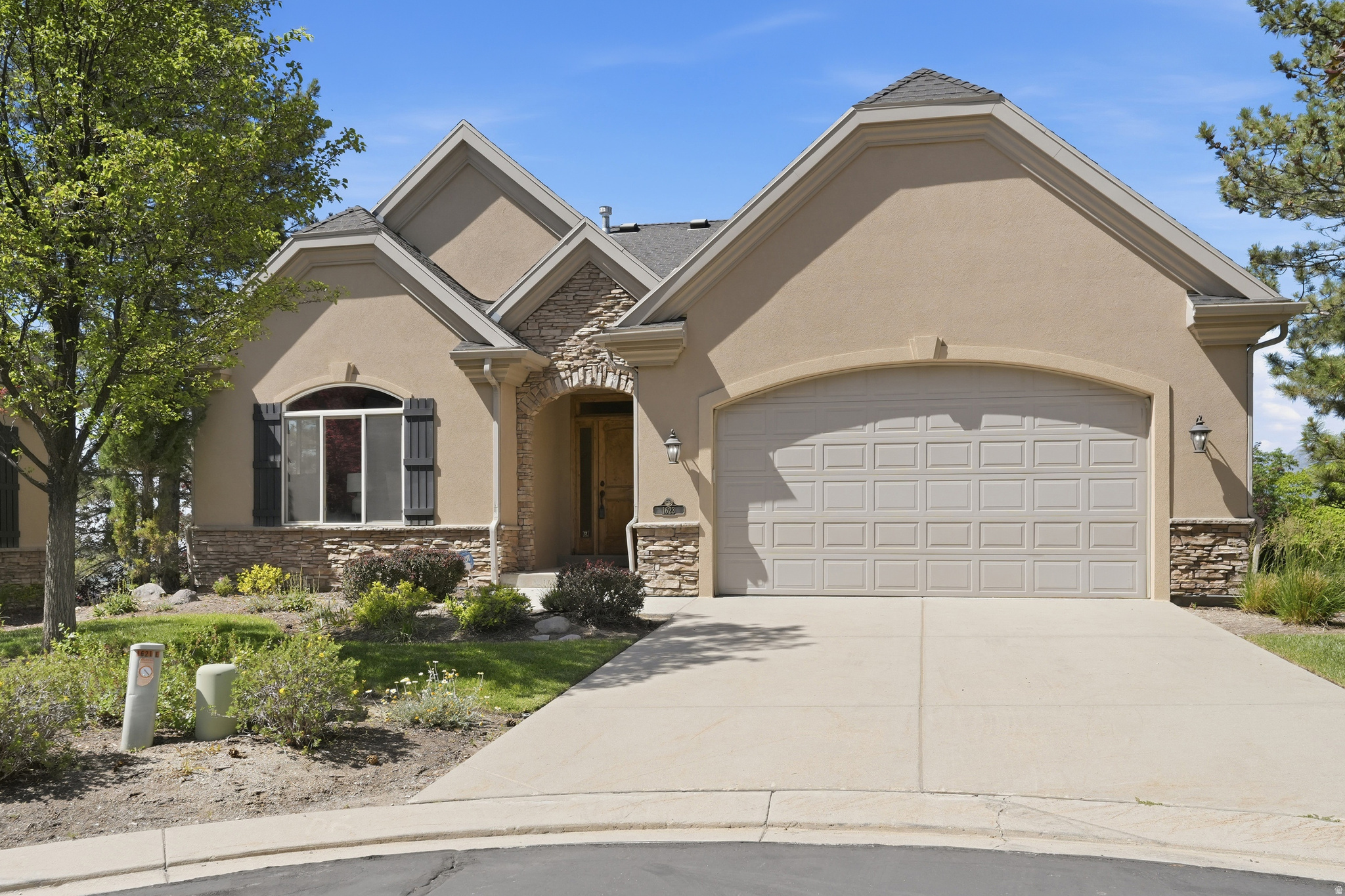 Experience refine main-floor living in this beautiful rambler located in a desirable gated Draper community. Offering approximately 3,600 sq. ft, this home features breathtaking mountain and valley views and is conveniently located near a golf course, shopping, dining, freeway access and recreation areas.  The open and inviting floor plan includes the primary suite on the main level, light and airy office space, living area has a fireplace and large window overlooking the covered balcony, kitchen with a large island with bar seating and a half bath. Soaring 10-ft ceilings on both both levels, walkout basement with abundant natural light throughout. The covered balcony provides the perfect setting to relax and enjoy the surrounding scenery. The above grade walkout basement offers exceptional living and entertaining space with a large family room, cozy fireplace, wet bar two additional bedrooms, full bath and a generous storage area.  All appliances are included, making this home truly move-in ready. Residents enjoy access to a community clubhouse and pool, adding to the low maintenance lifestyle this neighborhood provides. Enjoy the convenience of a thoughtfully designed floor plan and wonderful views. Easy to show.