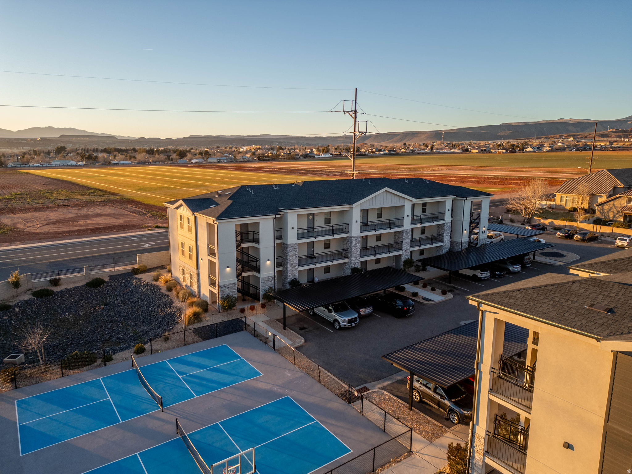 Welcome to this well-maintained RENTABLE 2-bedroom, 1-bath condo offering a bright and cozy living space with a functional, easy-flow layout. Perfect first home or investment property! Enjoy stunning mountain views and beautiful sunsets right from your home. Located in a quiet, peaceful community that still keeps you close to dining, shopping, and convenient freeway access. The community features great amenities including a pickle ball court, basketball court, and playground. HOA includes water, plus you'll appreciate assigned covered parking and ample guest parking for visitors. Comfortable, convenient, and perfectly situated--this condo has it all! Call today to schedule a private tour of this beautiful home!