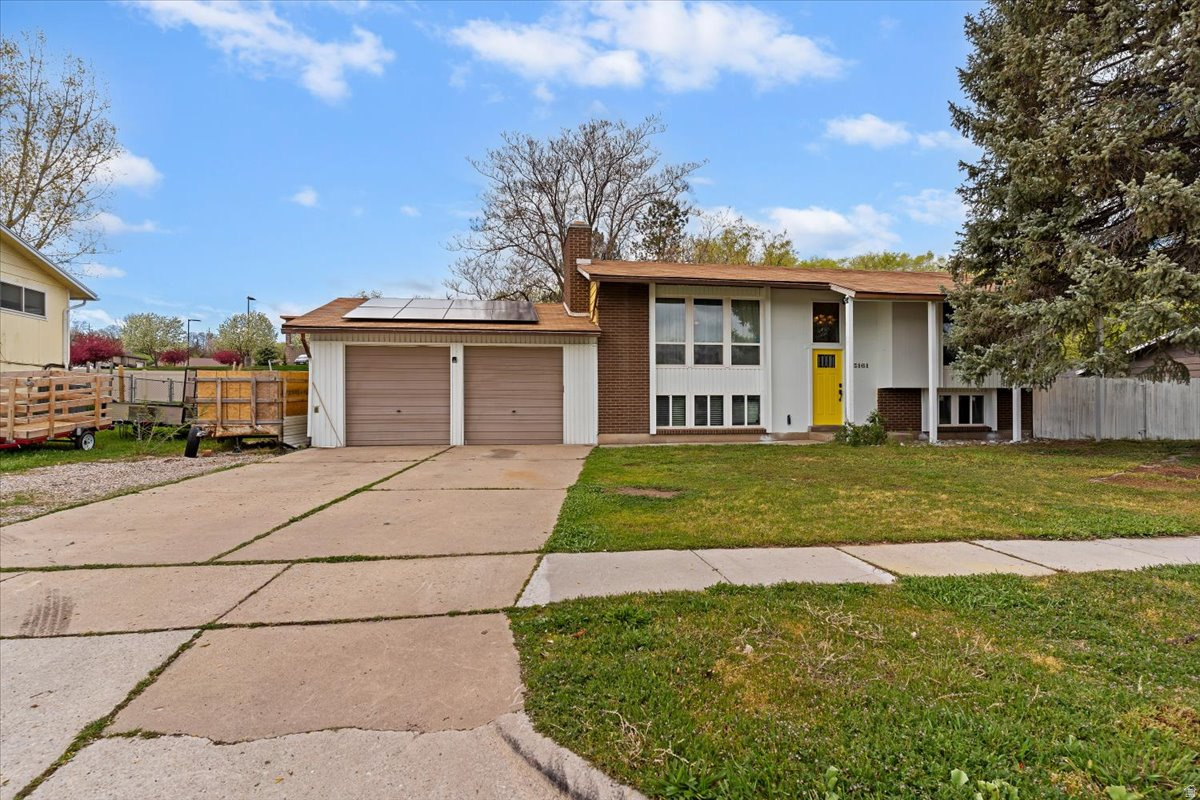 Charming home located on a huge .44 acre lot! Inside, you'll find spacious family rooms on both levels and a beautifully updated main bathroom featuring a double vanity and custom tile-surround showers. The home boasts generous bedroom sizes, including a walkout basement with the potential for a 5th bedroom (just add a closet!). Enjoy conveniences like on-demand endless hot water and an extra-deep 2-car garage. Whether you're relaxing on the covered patio, entertaining on the open deck, or letting the kids roam the massive yard, this property has it all. Perfectly located near shopping, a golf course, and large park. Sq. footage per tax data records. Property facts are provided as a courtesy; Buyer to verify all information.