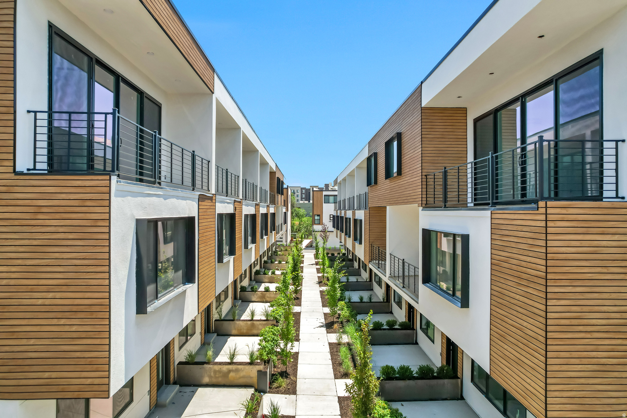 Now offering $6,000 in buyer incentives to use towards closing costs, rate buy down and/or appliances. COMMUNITY REINVESTMENT ACT CONVENTIONAL LOAN WITH INTEREST RATES AS LOW AS 5% FOR QUALIFIED BUYERS (ASK FOR DETAILS). FOR THE OPEN HOUSE, PLEASE COME TO THE MODEL LOCATED AT UNIT B104. Welcome to Opus Green. Experience the perfect harmony of modern comfort and environmental stewardship. Opus Green Townhomes offer a range of floor plans, including 2- and 3-bedroom townhomes, designed with meticulous attention to detail. From the spacious great rooms and gourmet kitchens to the tiled bathrooms and open stair railings, every aspect of Opus Green exudes sophistication and elegance for your comfort. This modern townhome community is all-electric with 9'7" cathedral ceilings, tiled showers and tubs with glass doors. Best in class, Pella windows, ductless, wall-mounted mini split air conditioners and heat pumps. Quartz countertops and a one of a kind floorplan not seen before. This end unit 3 bed 3.5 bathroom oasis will leave you green with envy. The 2 car garage with EV charging station, 1 touch smart home temperature control app and package storage/delivery service "Fetch Package", are just a few more added benefits to this zero emission environmental living townhome. Embrace a life of unparalleled comfort, elegance and fulfillment in the dwelling you've been longing for. Please navigate to our model at 4186 S Main Street, B #104, Millcreek UT 84107 for details and to gain access to unit M314
