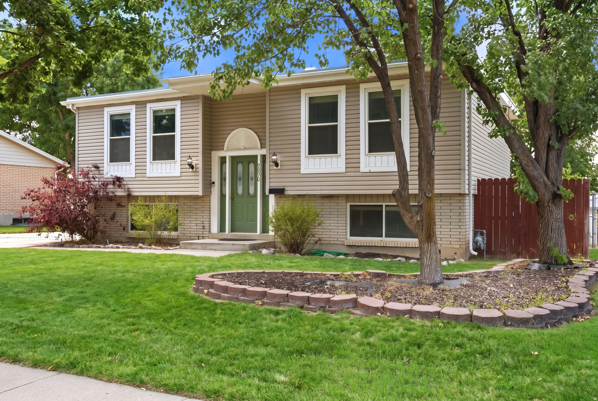 Welcome to this charming Sandy home, nestled on a quiet, tree-lined street in one of the area's most desirable neighborhoods. Inside, you'll find a bright and functional floor plan with inviting living spaces, plus a versatile basement family room that can easily serve as a fifth bedroom, home office, or flex space. Step outside to a spacious backyard featuring a large deck that's perfect for entertaining, summer BBQs, or simply relaxing. The oversized two-car garage offers plenty of storage and even includes its own toilet for added convenience. Located in the highly regarded Canyons School District with easy access to parks, shopping, dining, I-15, TRAX, and world-class recreation in Big and Little Cottonwood Canyons, this home is one you won't want to miss!