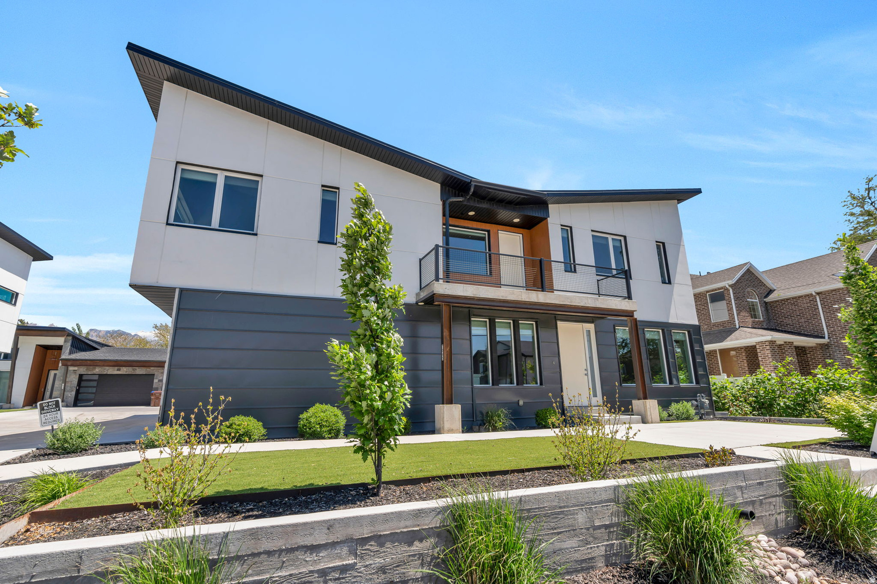 Striking modern twin home in Midvale built with concrete construction, offering exceptional durability, sound separation, and energy efficiency that sets it apart from anything else in the area. The main level features polished concrete floors, a spacious living area filled with natural light, and a well-appointed kitchen with white cabinetry, a large island, and a gas range. Upstairs, the primary bedroom includes a walk-in closet and a private ensuite, and two additional bedrooms share a full bathroom. A generous living area on the upper level provides additional space for relaxing or entertaining, along with a convenient laundry room. The fully finished basement offers 9-foot ceilings, a large recreation room, and a half bathroom. Additional highlights include a covered balcony with mountain views, a low-maintenance lot, and a 2-car garage. Conveniently located near shopping, dining, and major commuter routes in a desirable Midvale location. Measurements provided as a courtesy only, buyer to verify all info.