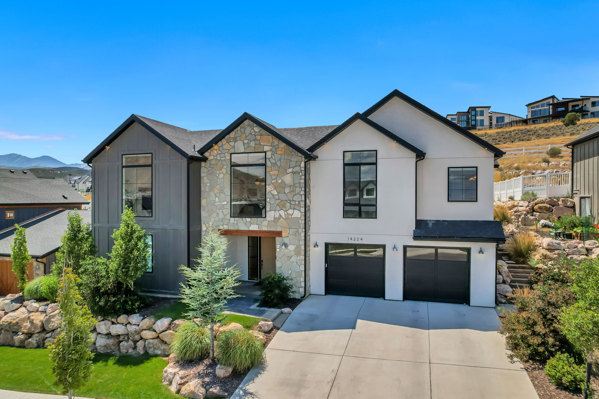 Executive-level home in Herriman featuring spectacular Wasatch Front views and an open, thoughtfully designed floor plan. The gourmet kitchen offers stainless steel appliances, quartz countertops, a large center island, and an oversized butler's pantry with abundant storage and  a second refrigerator.  The spacious great room showcases a gas fireplace, expansive east-facing windows, and automatic solar shades that provide comfort while preserving the views. The primary suite features automatic blackout shades, a spa-inspired bath with a freestanding tub, large walk-in shower, and a large walk-in closet with built-in organizers. The finished lower level includes additional bedrooms and a generous family room with wet bar perfect for entertaining, movies, or games. Car enthusiasts will appreciate the large 4-car garage measuring approximately 40' deep by 25' wide. Enjoy peaceful mountain living with convenient access to the Mountain View Corridor, shopping, dining, theater , Silicon Slopes, Salt Lake International Airport, world-class skiing, and the nearby Yellow Fork Canyon trail system.  Square footage figures are provided as a courtesy estimate only and were obtained from appraisal.  Square footage figures are provided as a courtesy estimate only and were obtained from appraisal.  Buyer is advised to obtain an independent measurement.