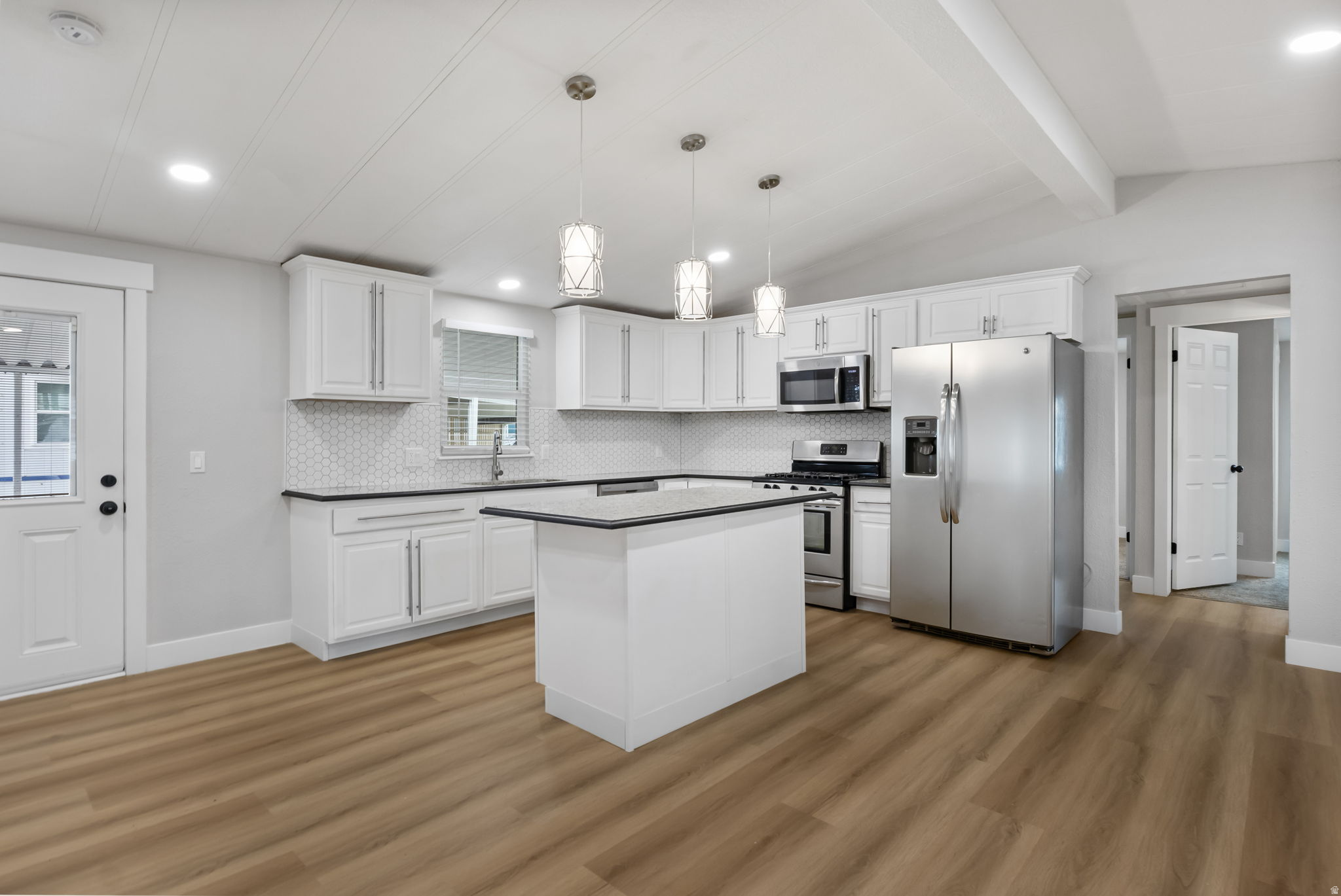 PRICE REDUCED! Charming and wellmaintained home in a great community. Fresh updates, home warranty included, and ready for a quick movein."  3bed home in the Camelot community with a clean, modern interior and an open layout. Affordable North Salt Lake living with quick access to I15, shopping, and dining. Movein ready with fast closing available after park approval. Home warranty included for added peace of mind. Buyer must be approved by the park. Easy to show come see the value.