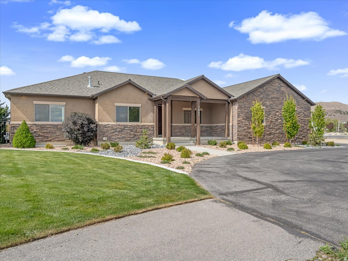 This home is a DREAM!  Inside and out, SO much gathering space, with beautiful finishes everywhere!  The main floor was remodeled at the same time the basement was finished (2023), and no expense was spared in creating functional living space with high-end finishes.  Spacious bedrooms, beautiful master suite with custom closet and incredible shower (think "full-service human car wash).  Basement has a separate entrance, and features a wet bar in the basement great room.  Both basement bedrooms have ensuite baths, and the gym room is large enough to please most any workout enthusiast!  The cold storage gives you a choice as well... you can have the most secure food storage in the neighborhood, OR use it as the most gorgeous walk-in gun safe you've ever seen!  Permanent holiday lighting, Ring doorbell, and several Ring cameras are included.  Also, there is a sump pump in the bottom of the basement entrance stairway, in case Mother Nature goes rogue.  Large, fully landscaped lot has animal rights, but is currently set up with outbuildings specifically made for Falconry.  Can easily be converted for use as chicken coops, garden sheds, ATV garages, etc...  Yard is accessed through a powered gate, with plenty of space for whatever you need room for.  The gigantic pergola offers ample shade to the back patio area, complete with outdoor lighting, portable firepit, gas stub for BBQ, and lots of room for patio furniture and relaxation.  Words can't do this home justice, schedule an appointment to see it today!