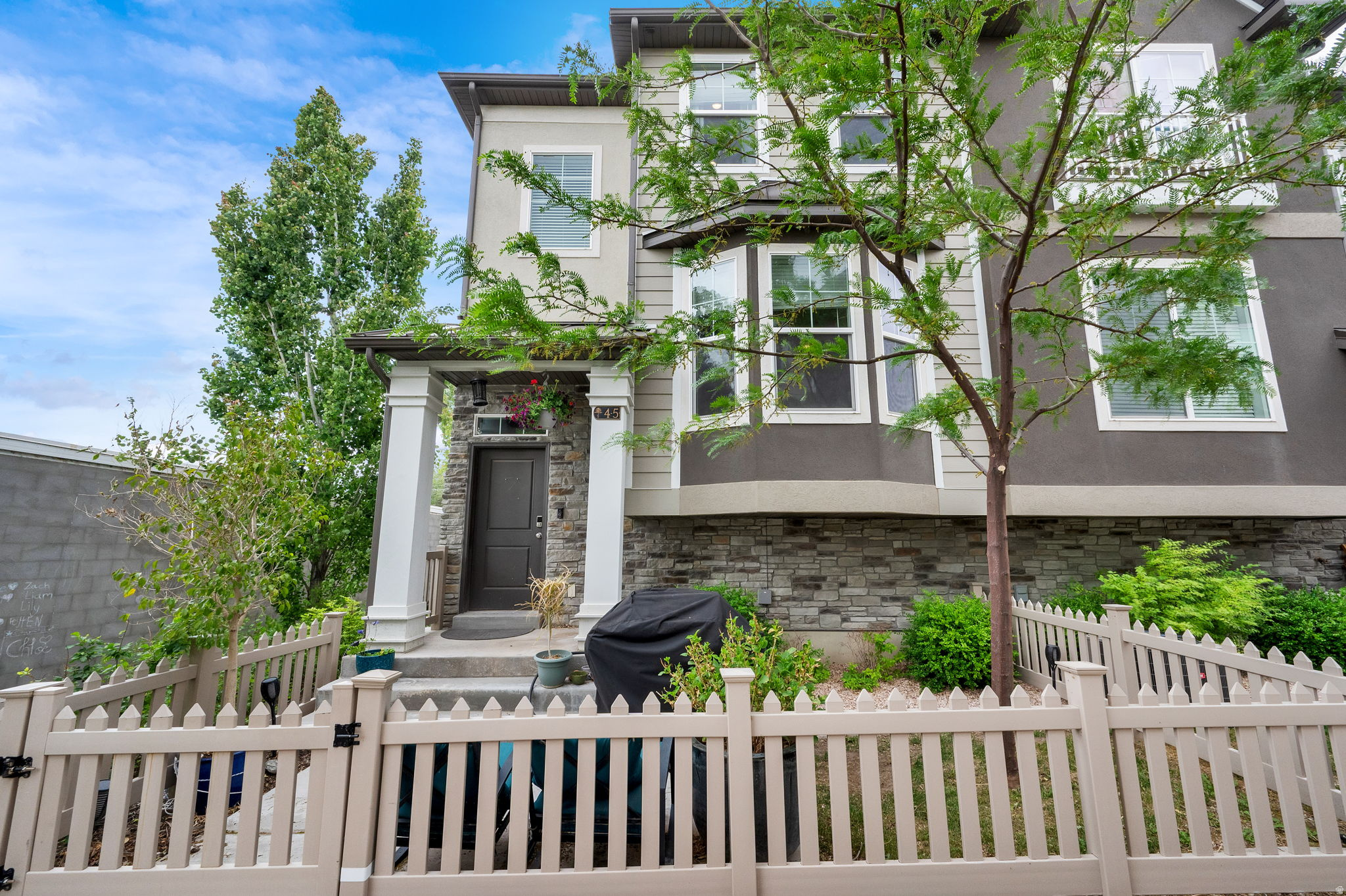 This beautifully updated townhome in the heart of Woods Cross offers modern style, thoughtful upgrades, and an ideal layout. The open-concept main living area features high-end finishes throughout, including LVP flooring, quartz countertops, and classic subway tile accents. The spacious kitchen is perfect for cooking and entertaining, complete with a large walk-in pantry and a newer dishwasher.  The home is thoughtfully designed with a functional landing area just inside the oversized 22-foot-deep garage. Upstairs, the third level includes comfortable bedroom spaces and two full bathrooms featuring tile surrounds and quartz countertops. Although only six years old, the home has been extensively improved with added shelving and storage in the garage, extra cabinetry in the bathrooms, and custom shelving in the laundry area. Smart home features include an app-controlled garage door, smart lock, Nest thermostat, and Google Fiber connectivity. The newer LG washer and dryer are also included. As an end unit, the home enjoys abundant natural light from additional north-facing windows. Sellers have especially appreciated the extra community parking located directly beside the garage. Situated in a quiet section of the community near the city park, this townhome combines convenience, comfort, and modern living in one of Woods Cross's most desirable locations. Home features the best of both a quiet, nice neighborhood, but close to easy access to I-15 for commuting north or south and is within walking distance of the FrontRunner stop, perfect for commuting. Square footage figures are provided as a courtesy estimate only and were obtained from County Records.  Buyer is advised to obtain an independent measurement.