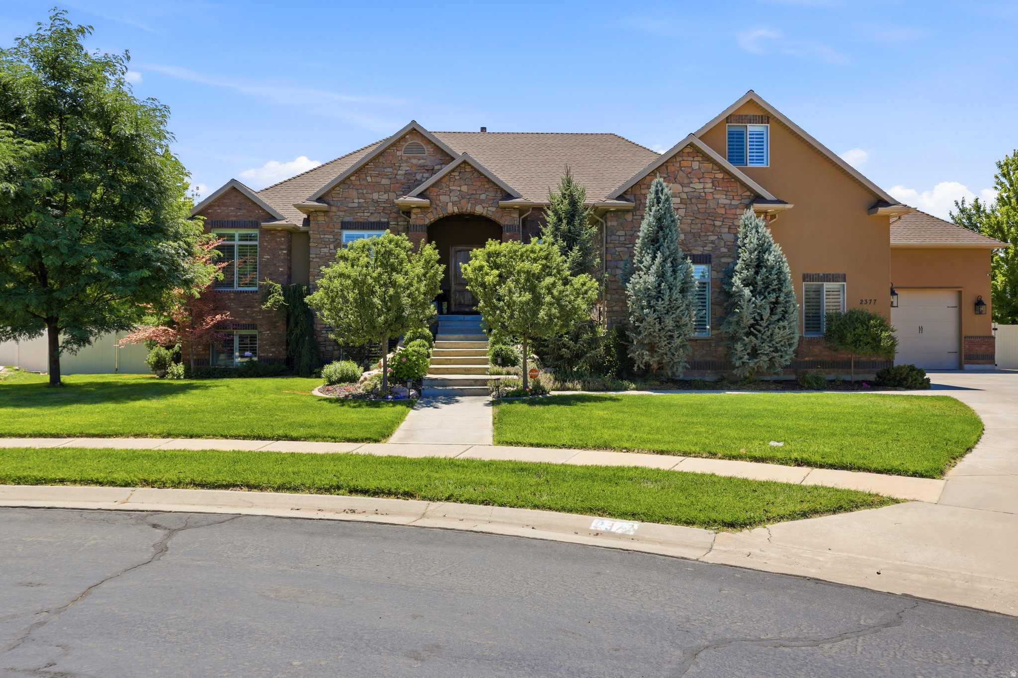 5,385 sq ft rambler on .73 acres with a fully finished walkout basement apartment, oversized 4-car garage, RV parking, cul-de-sac lot, no backyard neighbors, with an incredible backyard full of trees you'll have to see to believe.  Step inside to discover a thoughtfully designed home with the perfect layout. Enjoy the beautiful front entry, double sided fireplace, as well as an amazing kitchen with double ovens. Downstairs comes with a dedicated home theater, and a fully equipped basement apartment complete with its own private entrance, full kitchen, multiple bedrooms, family rooms, and separate laundry-perfect for multi-generational living and guests.  Outside, the expansive backyard is the true showstopper. Whether you're entertaining on the covered deck, gardening, or in the hottub, this rare .73-acre property offers endless possibilities. The oversized 4-car garage and RV parking provide all the space you need for vehicles, toys, and hobbies.  Located in a desirable West Haven neighborhood with convenient access to schools, parks, shopping, and commuter routes, this is a rare opportunity to own a home that truly has it all.