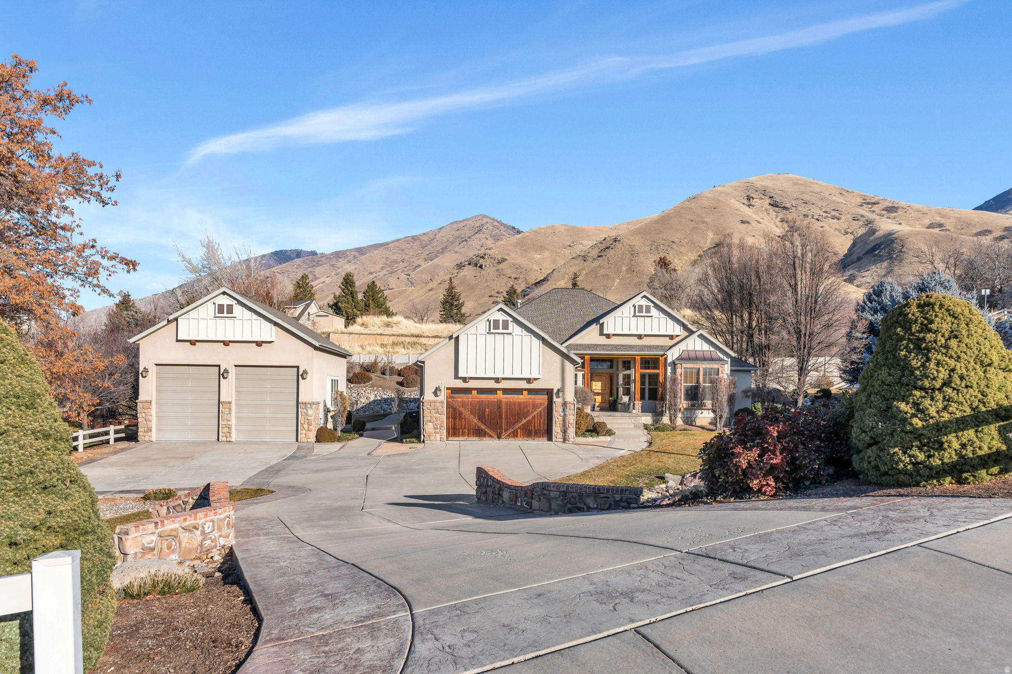 This is the home you have been waiting for  an impeccably maintained rambler on a secluded .61 acre lot at the mouth of Hobble Creek Canyon in Springville Utah.  The property offers 4465 square feet with 6 bedrooms and 4 baths, an open main level with formal living and great room, and a spacious kitchen with double ovens and generous dining space. The primary suite features a jetted tub, separate shower and walk-in closet, while the fully finished daylight basement adds a theater room, large family room and additional bedrooms, creating comfortable spaces for both everyday living and entertaining.  Outside, mature trees, a terraced yard, and mountain views create a private, park-like setting just minutes from canyon parks, trails, Hobble Creek Golf Course and city amenities. Attached and Detached garages with extra height, width, heated parking and ample storage are ideal for vehicles, outdoor gear, and a heated workshop.  Modern touches such as fiber internet, smart thermostats, central vacuum, and a video doorbell make this home as functional as it is beautiful.  Living here means enjoying peaceful canyon living with quick access to Springville's schools, shopping and dining  a rare combination of seclusion and convenience.