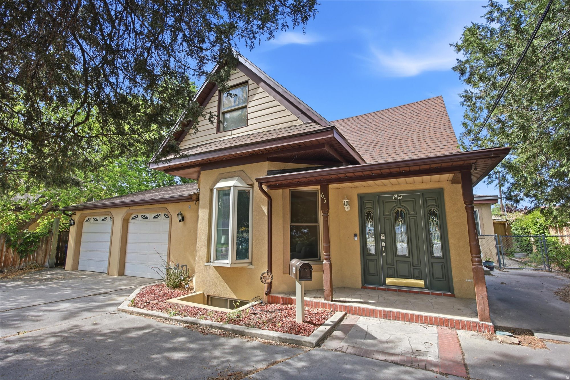 This is one of Historic Sandy's most unique homes just over 4,400 sq ft which features 5 bedrooms, 3 baths, hardwood floors, crown molding, and stunning travertine and tile throughout, plus a unique game room and a fully enclosed back patio with indoor hot tub. The lower level has a complete mother-in-law apartment with its own kitchen, living room, laundry, and full bath, while the oversized 2-car garage offers a large workshop and storage space in the back. Major updates include solar panels, a newer roof, and new front windows all the character of a historic home with great improvements. Close to everything Sandy has to offer on a spacious .31-acre lot. Too many extras to list.