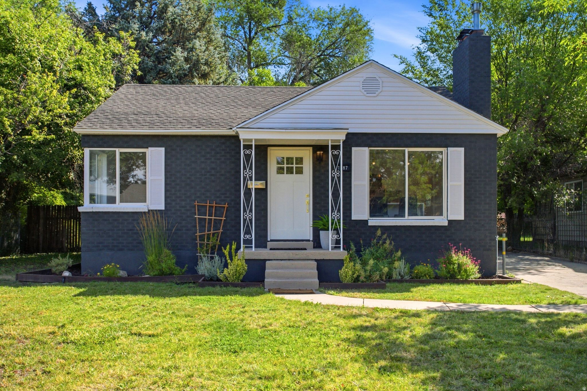 *GRAND OPEN HOUSE 7/11/26  from 11AM TO 1 PM*  Welcome to this wonderfully updated home situated just minutes from Millcreek Commons, Interstate 15, shopping and restaurants. The kitchen has beautiful quartz countertops with waterfall edges, a nice center island and wonderful large picture windows allowing tons of natural light. The bathrooms have been updated with gorgeous tiles. The backyard is very spacious with a large, covered patio, perfect for entertaining. Come see this stunner and make it your own. Square footage figures are provided as a courtesy estimate only and were obtained from county records. Buyers are advised to obtain an independent measurement.  Square footage figures are provided as a courtesy estimate only and were obtained from county records.  Buyer is advised to obtain an independent measurement.