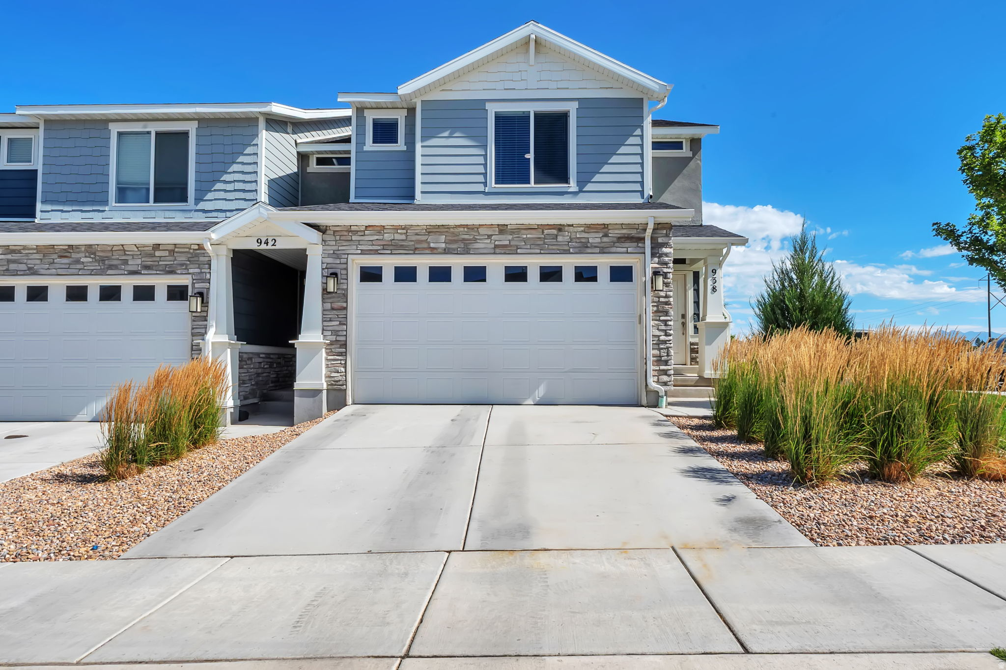 STUNNING END-UNIT TOWNHOME! This beautifully maintained home features an open floor plan with laminate flooring throughout the main level. The kitchen offers quartz countertops, beautiful cabinetry, stainless steel gas appliances, a breakfast bar, and a pantry.  The spacious primary suite features a private ensuite bathroom and a large walk-in closet. The 100% finished basement provides incredible additional living space and also offers endless possibilities as a guest suite, game room, or man cave.  Additional features include a smart home package with a smart thermostat, smart garage door opener, and video doorbell camera.  Conveniently located near schools, shopping, dining, parks, and playgrounds. Community amenities include a swimming pool, pickleball and sand volleyball courts, playgrounds, an all-terrain park, tot lot, dog park, and picnic areas.