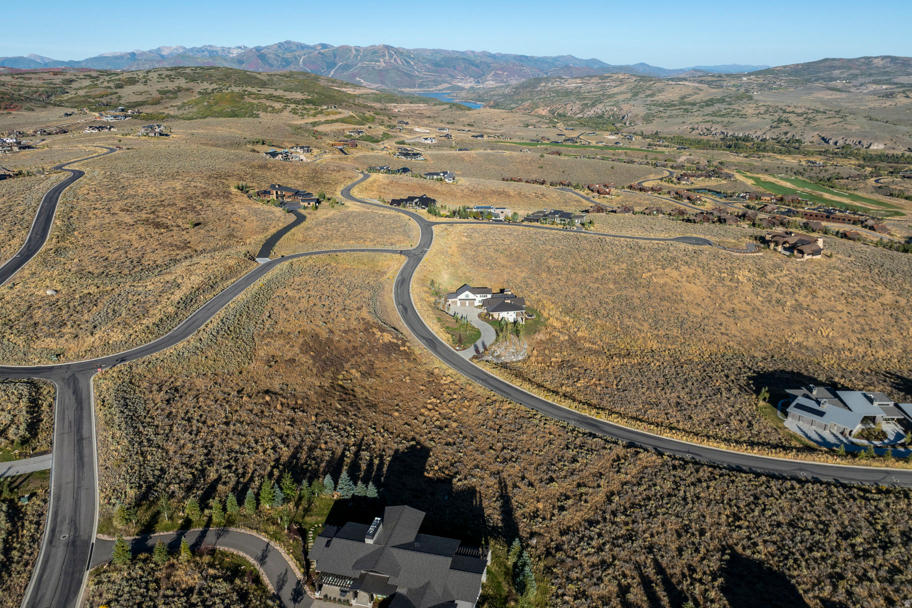 Set against sweeping mountain vistas, this 3.6-acre Estate Lot captures the essence of mountain living at Victory Ranch. The elevation of this lot provides long view corridors in several directions including a panoramic sweeping view of Deer Valley, the Rees Jones golf course, Flat-Top mountain, the Rock Cliffs, and the Unita Mountain range.  This gently sloping downhill lot allows for a large home up to 9,000 sq ft, blending architectural freedom with an easy build site. Located just a short stroll from The Barn amenity, the VR activity hub with spa, pool, fitness,  game room, sport court, Parlor restaurant, tennis, pickle and paddle courts.   Surrounded by beautifully constructed homes, this corner lot provides a balance of privacy and community. The 20,795 sq ft building pad, complete with sun study, and fully stubbed utilities make this an architect-ready site.  This lot also offers view permanence with open space below and adjacent lots already built. This is the ideal opportunity to create your own serene retreat or statement mountain estate.  Nestled on 6,250 acres with four miles of private frontage on the Upper Provo River, Victory Ranch is a premier four-season private community offering world-class recreation and refined mountain living. Highlights include an 18-hole Rees Jones golf course, fly fishing, upland bird hunting, and 30+ miles of trails for hiking, biking, and exploration across 3,500 acres of backcountry. Amenities include The Post Clubhouse with concierge services, pool, hot tubs, and caf; and The Barn, featuring a fitness center, spa, sport courts, pool, water slide, and family recreation spaces. Additional offerings include a shooting facility, archery range, ATV and snowmobile trails, backcountry yurts, restaurants, private ski lodge in Park City, and shuttles to Deer Valley & Park City. Ideally located 15 minutes from Deer Valley, 25 minutes from Park City, and under an hour from Salt Lake City International Airport, Victory Ranch combines adventure, community, and luxury in one exceptional setting.