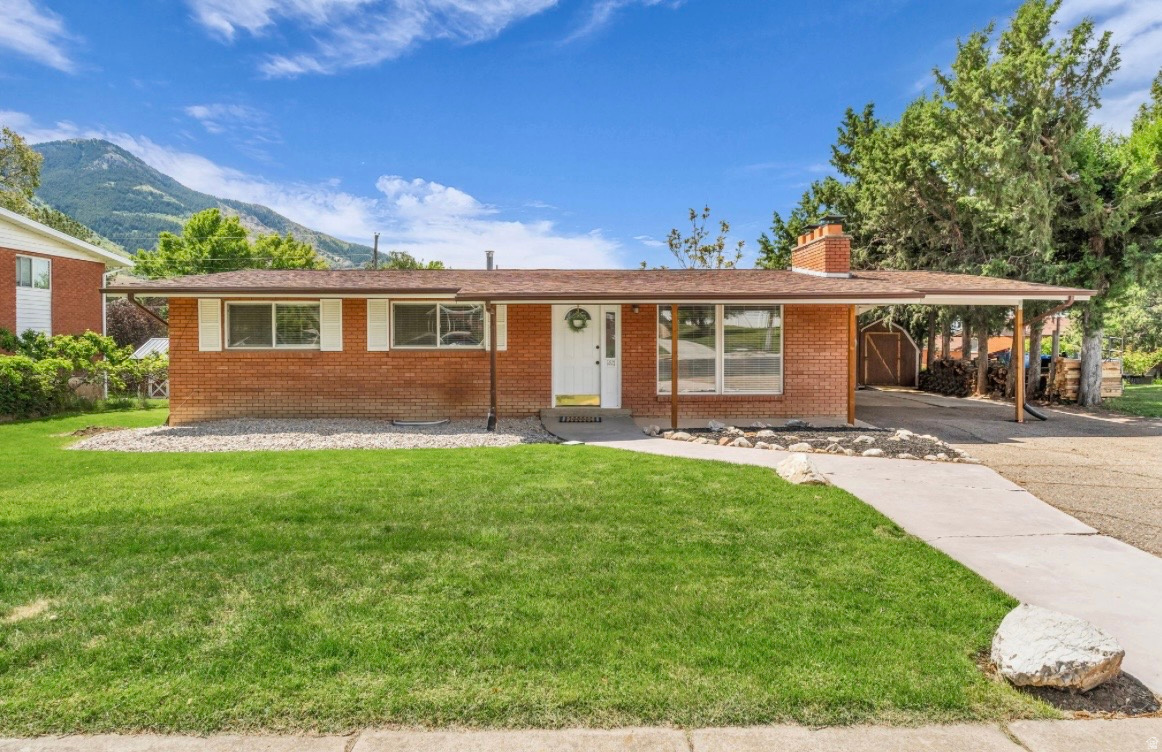 Welcome to this beautiful east bench North Ogden home, perfectly situated in a quiet neighborhood with stunning mountain views. Featuring 5 bedrooms, 2 bathrooms, and plenty of flexible living space, this home offers room to spread out, gather, work, and relax. The functional layout includes a spacious kitchen with stainless steel appliances, two separate living areas, an additional basement office, and two cozy fireplaces that add warmth and charm. Even better, ALL APPLIANCES ARE INCLUDED! Yes, even the washer and dryer! Making this home truly move-in ready. Out back, enjoy the patio and huge backyard, offering endless possibilities for entertaining, gardening, play, pets, or simply soaking in those gorgeous Utah views. With two storage sheds for extra organization and convenient access to schools, trails, shopping, and local amenities, this home has the space, location, and lifestyle buyers are looking for. Move right in and call this house your home!