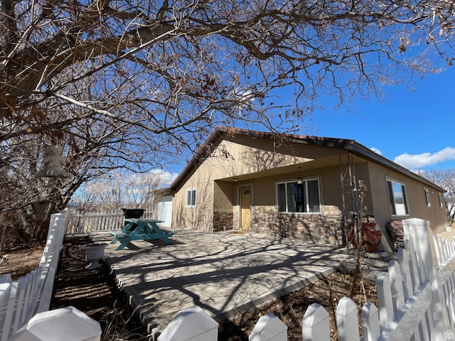 The perfect horse property on 5 acres in Altonah! Bring your horses and animals and enjoy a fully set-up property featuring corrals with multiple stalls, a round pen, loafing shed, Quonset and other sheds for storage. The property also includes a she-shed, root cellar, and a beautifully landscaped yard surrounded by vinyl fencing. Inside, the home has been thoughtfully updated with a fully remodeled kitchen featuring quartz countertops, an island, and new appliances, along with other updates. Includes 5 shares of BIA irrigation water (buyer to verify water shares). Act now on this one!
