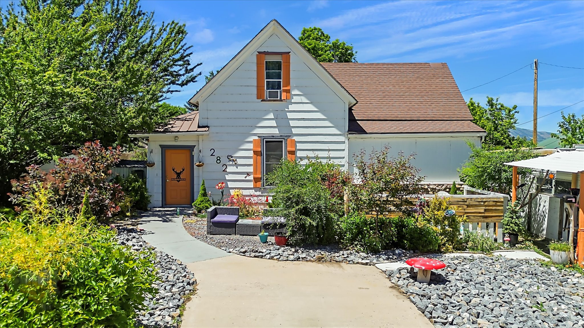 Charming cottage-style home full of character and modern updates. This inviting 4-bedroom, 2-bath home offers a blend of timeless charm and everyday comfort. The  updated kitchen serves as the heart of the home, while major improvements including electrical, plumbing, water heater, and roof updates within the last 5-10 years provide added peace of mind. The primary bedroom is conveniently located on the main floor, offering easy single-level living. Outside, you'll fall in love with the whimsical outdoor spaces featuring fruit trees, grapes, and raspberry/blackberry bushes, cozy gathering areas, and plenty of room to relax and enjoy the surroundings. Ample parking provides space for vehicles, trailers, toys, and guests. Ideally located near Hyrum Reservoir, this property offers easy access to boating, fishing, and outdoor recreation while maintaining the warmth and charm of a peaceful cottage retreat. Don't miss the opportunity to own this unique and inviting home! Buyer to verify all information.