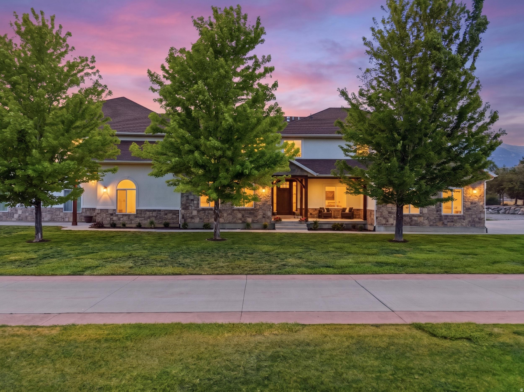 Wide open spaces are a reality! Settle down on your own 1.5 acre country estate in the prestigious Alpine community. Rather than wasting years to build a home, come move right into this masterpiece. The interior living area has all been completely renovated with the professional designer Lane Prince and general contractor Sam Winegar. No expense has been spared--Luxury vinyl plank, quartzite countertops, luxury fireplace, butler's pantry/prep kitchen, newly expanded culinary kitchen. When we say new: we mean new carpet, paint everywhere, lighting, fixtures, bathrooms, trim, tile, custom cabinetry, laundry room, powder bath, epoxy floors in the garage... the list goes on! The gorgeous new primary suite is styled for views, privacy and relaxation with luxurious spa-like shower and bathtub. The large walk-in closet even has its own washer/dryer hook up. The expansive property can host a large amount of cars, huge gatherings on the large patio and lawn. The rear area of the property would be a great spot for a barn and pasture. The property shares a main private drive with the horse property to the south. To the north, enjoy a quiet neighbor: a large field with unobstructed views of Lone Peak. A unique aspect of this home is the recording studio and adjacent quiet rooms. Carl J. Yanchar, the LA studio designer, imagined the it all--the studio is perfectly equipped for podcasts and other commercial production projects. Come tour the master control room, equipment room, and see the available to purchase production equipment. Access the main living space from the large recording foyer/waiting room, with its own guest bathroom and kitchenette area, bringing convenience for your professional guests. A true creator's dream! If a recording studio is not on your wish list, the area could easily be renovated into an indoor hobby garage, sports court, events room, game room, home gym or dance studio. The large unfinished basement has incredible potential for your future plans! There are so many awesome surprises in this well-designed home. You have to see it to believe it!  Square footage figures are provided as a courtesy estimate only and were obtained from appraisal.  Buyer is advised to obtain an independent measurement.