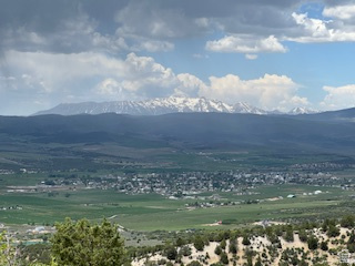 Breathtaking, panoramic views of Mt. Pleasant, Fairview, and the majestic Mt. Nebo from this exceptional, ready-to-build lot. Perfectly positioned to capture stunning, unobstructed scenery in every direction, this property offers the ideal setting for your dream home or a peaceful mountain retreat. Endless recreational activities including hiking, mountain biking, four wheeling, dirt biking, and more, plus nearby lakes, fishing, hunting, rock climbing, etc. In the winter, access is by snowmobiles or other tracked vehicles. The mountain air is the best. Close to grocery stores, pharmacy, restaurants, Drive-in theater and other amenities. Extensive groundwork has already been completed, saving you both time and money. Driveway has been cut in with a functioning culvert provides easy access, while the homesite has been cleared, leveled, and prepared for lots of parking space.  Utilities are already in place for your convenience-the water meter has been installed (a significant cost savings), and both the water line and power conduit have been run directly to the homesite, with power stubbed at the front of the lot.  With over $20,000 in improvements already completed, this property is truly turn-key and ready for your vision.