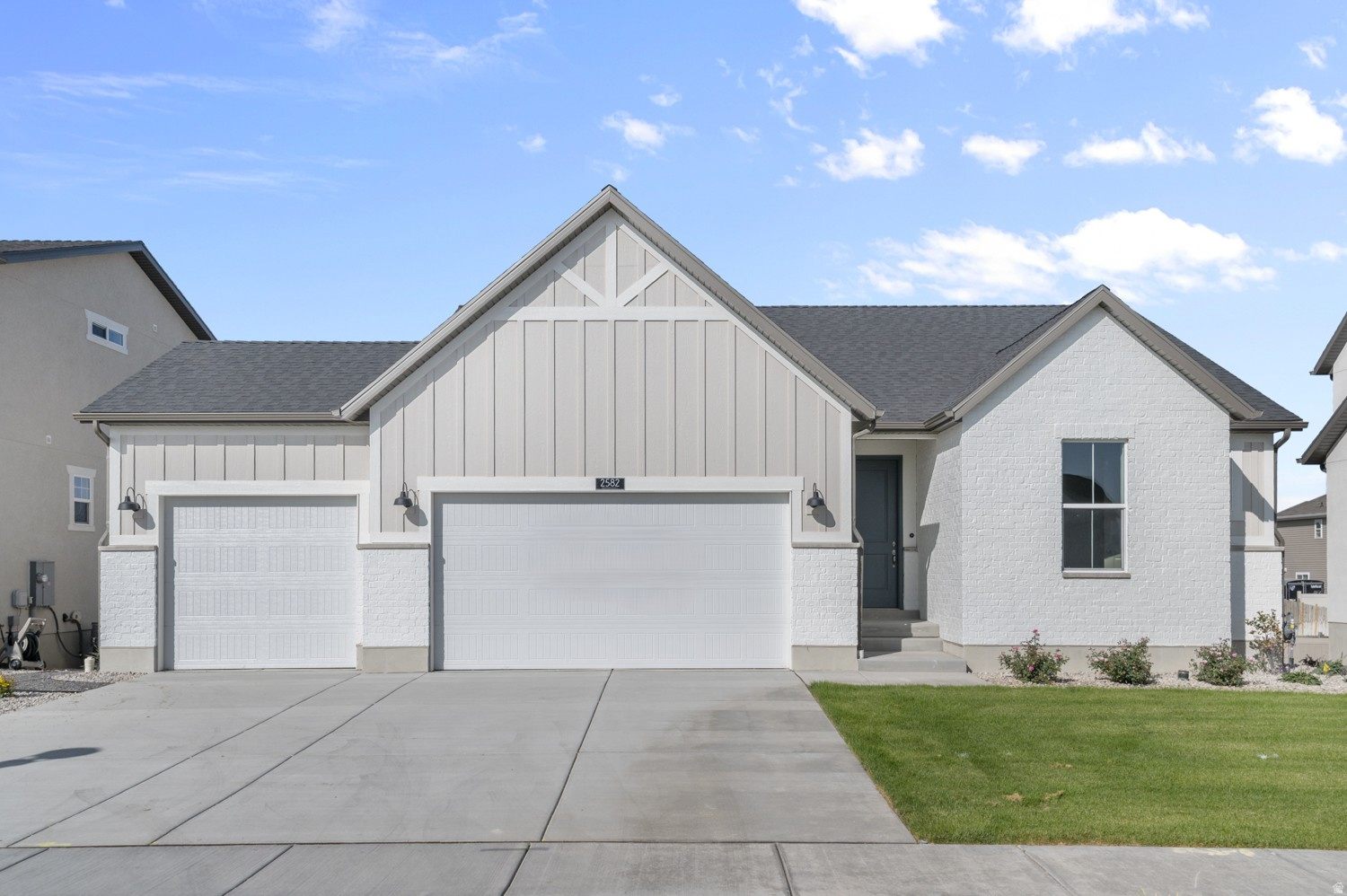 This inviting 1350 Farmhouse combines charm and comfort with smart design in a great community. Practical upgrades include a 3-car garage with keypad & exit door, 9-foot basement foundation walls with a walk-out door, can lighting, Christmas light outlets, a tankless water heater, and energy-efficient options throughout. The kitchen features white laminate cabinets, quartz countertops, stainless steel gas appliances, and a box window in the nook for added light and character. Flooring includes a balance of laminate hardwood, vinyl tile, and carpet, designed for durability and style. Inside, timeless touches shine with Craftsman base & casing, cultured marble shower surrounds in the owner's suite, and satin & brushed nickel hardware. The box window in the owner's bedroom enhances natural light and creates a cozy retreat. Comes fully landscaped and maintained by the HOA for hassle free living! This home offers the perfect blend of modern convenience and farmhouse charm! Come check it out today!