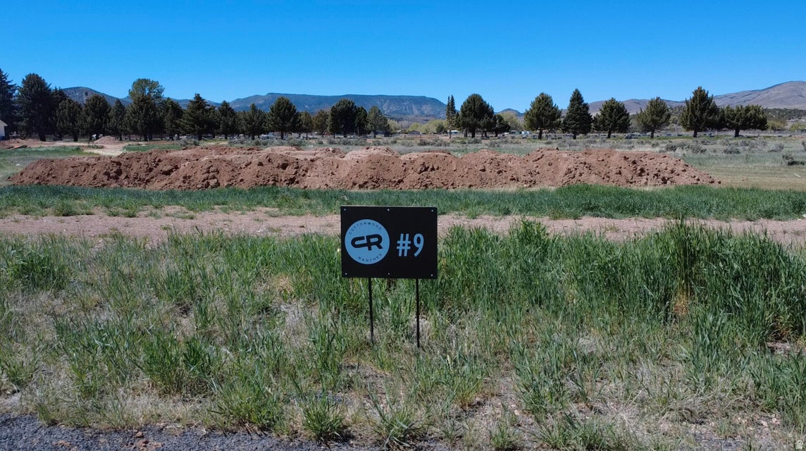 Come experience country living at its finest in Cottonwood Ranches--Enterprise's newest premier equestrian subdivision. Designed with horse lovers and those seeking space in mind, this community offers large lots ranging from 0.5 to 1.5 acres. Lot #9 features 1.25 acres of flat, usable land--perfect for building your dream home, barn, and corrals. Located within Enterprise city limits, utilities include water, power, fiber optics, and natural gas, with septic required for sewer. Up to 5 large animals are permitted. Enjoy the charm of Enterprise, a self-sufficient rural community offering grocery stores, restaurants, schools, medical services, and more--all while being just 40 minutes from St. George and Cedar City. Bring your own builder and create your ideal lifestyle. Impact fees are approximately $13,000.