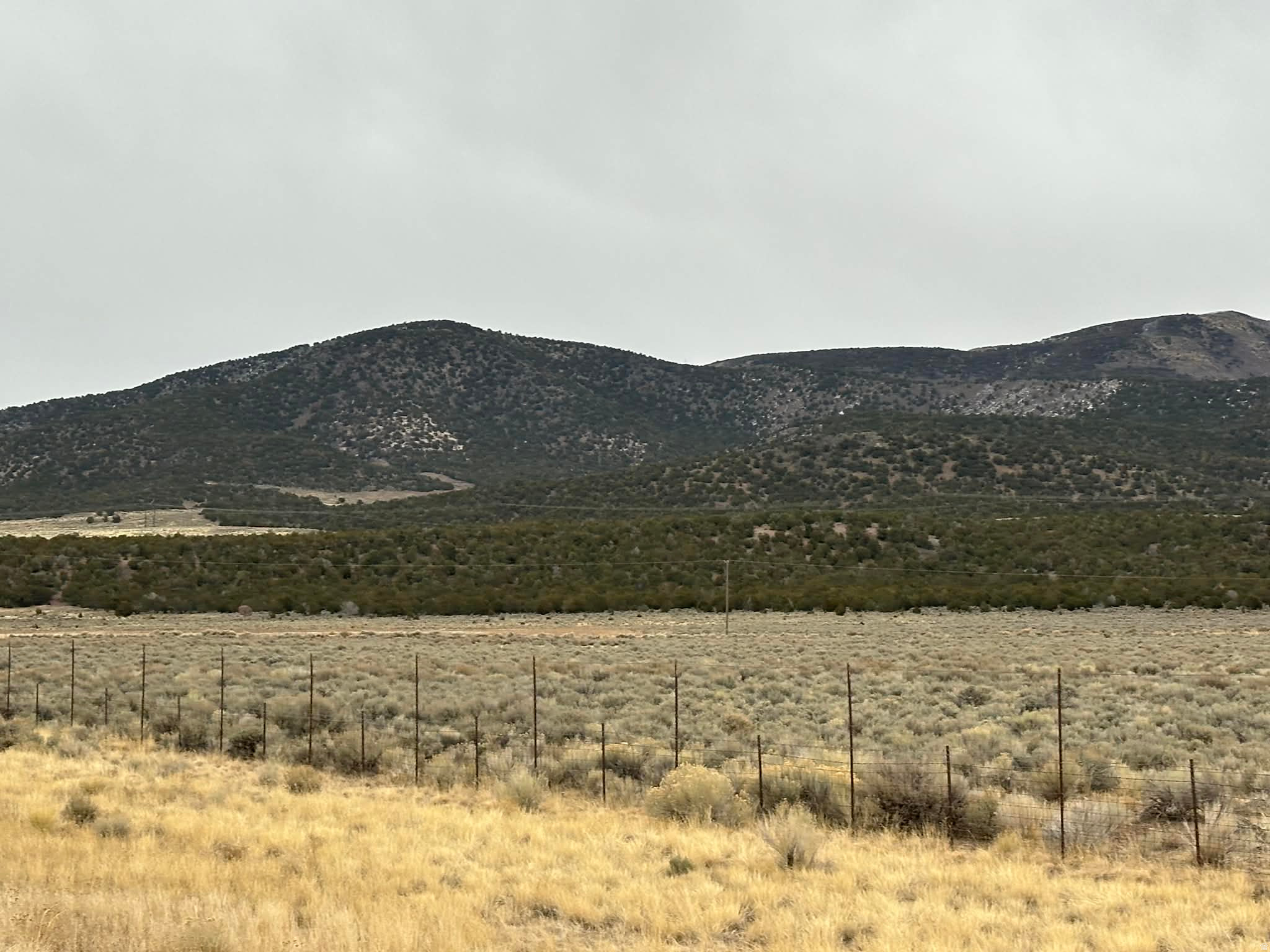 Prime 30-acre parcel with over 1000' of frontage along Interstate 70, and frontage along HWY 161. Located right off I-70 @Exit #1.  The property includes 1.73 acre-feet of underground water rights.  (WR#71-6078).  The property sits near Historic Cove Fort and offers excellent visibility, access, and traffic exposure.  The surrounding area is seeing strong momentum with geothermal plants, solar farms, and proposed data centers driving long-term economic growth and increased traffic along Highway 70. This location is well-positioned for future commercial, industrial, or land-banking opportunities tied to expanding infrastructure and energy development. This is a rare investment opportunity along a key transportation route in central Utah, with long-term upside as regional growth continues.