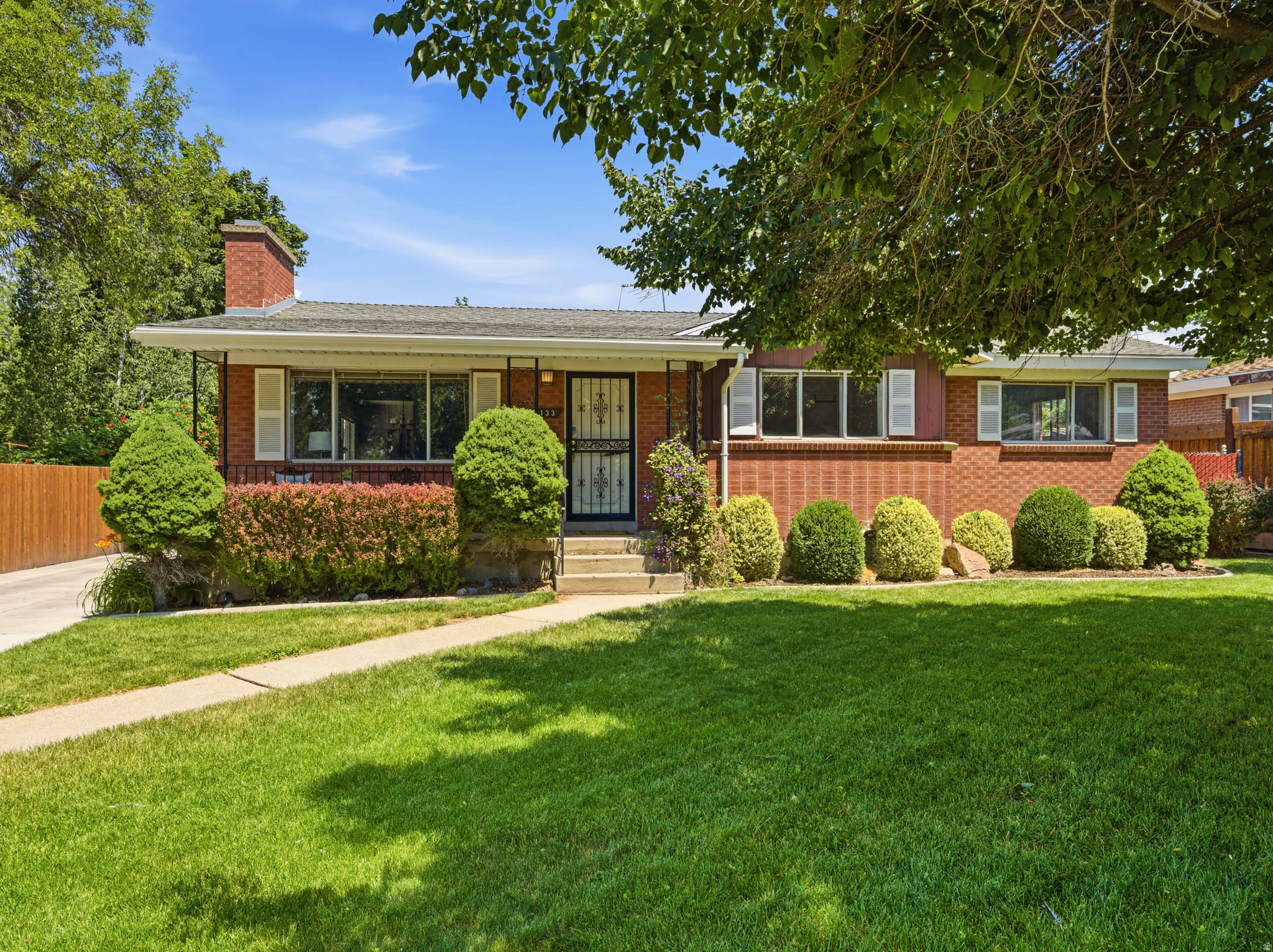 For the first time in decades, this cherished one-owner home is ready for its next chapter. Lovingly maintained throughout the years, it offers the kind of solid construction, pride of ownership, and "good bones" that are becoming increasingly hard to find. Whether you're looking for a home to enjoy today while updating over time or searching for an opportunity to build equity in one of Millcreek's most desirable neighborhoods, this property delivers exceptional value and potential. The spacious floor plan offers features rarely found in homes of this era, including an oversized kitchen with abundant cabinetry, generous countertop space, a center island, and an adjoining dining area perfect for everyday meals and gatherings. Newer carpet and luxury vinyl plank flooring create a fresh, move-in-ready feel, while the partially updated bathrooms provide a great head start for future improvements. Cozy wood-burning fireplaces on both the main level and downstairs add warmth and character, creating inviting spaces to gather throughout the seasons.  Step outside to a large covered patio overlooking a beautifully maintained, private backyard offering an ideal setting for summer barbecues, quiet mornings, or evenings spent with family and friends. A newer extended driveway leads to an impressive 24' x 28' oversized two-car garage featuring a 10-foot door, making it perfect for larger trucks, SUVs, recreational vehicles, extra storage, or a workshop. The location is equally compelling. Nestled in the heart of Millcreek, you'll enjoy quick access to Big and Little Cottonwood Canyons, world-class hiking, biking, skiing, and year-round outdoor recreation, while remaining just minutes from shopping, dining, parks, excellent schools, and downtown Salt Lake City. This is a home where you can embrace Utah's incredible lifestyle while creating a space that reflects your own style and vision. Solid, well-loved, and full of opportunity, this home offers a rare chance to make thoughtful updates over time while investing in an exceptional neighborhood and building lasting value.